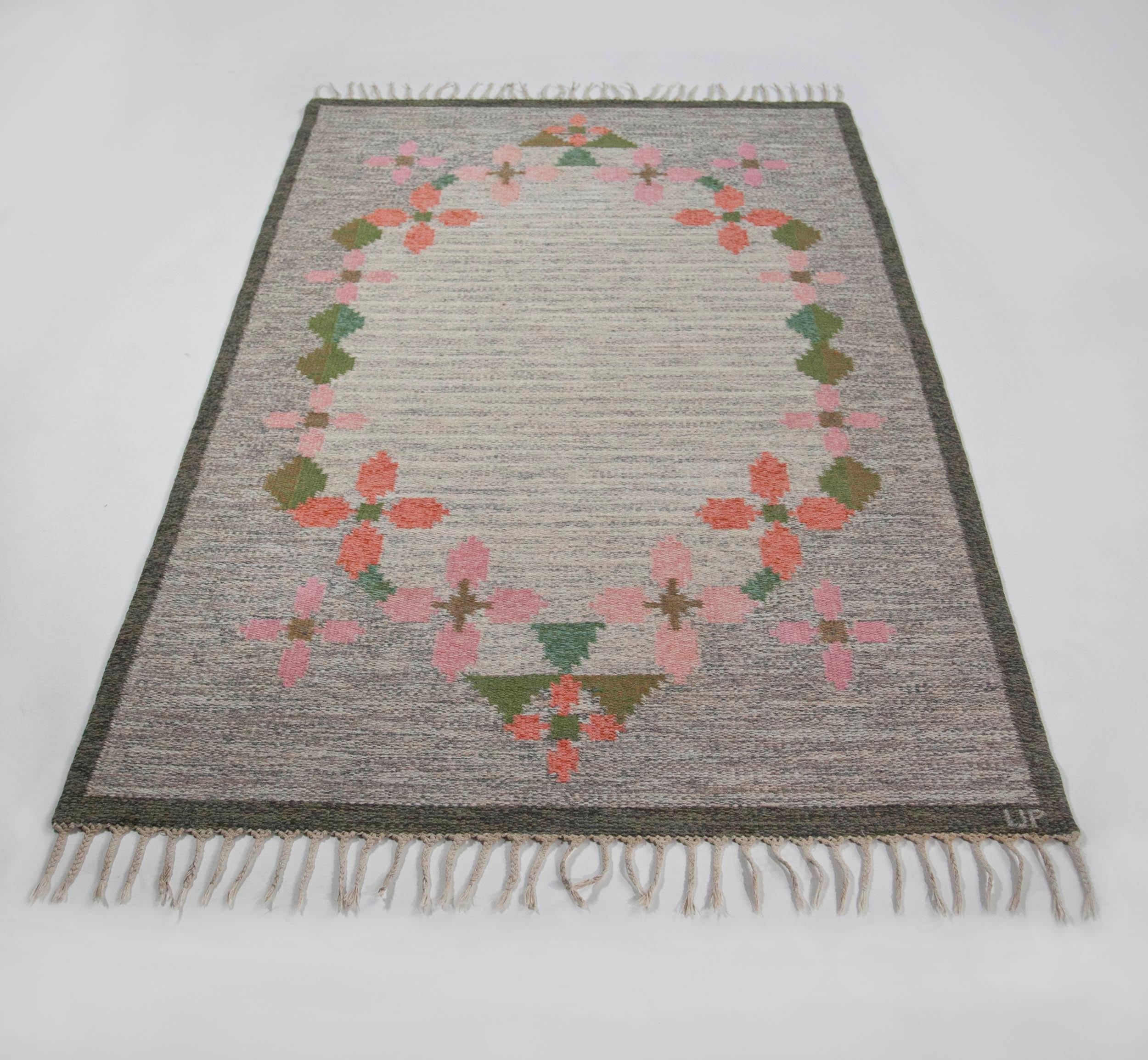 Ulla Parkdah Swedish flat-weave rug, signed UP, Sweden, 1960s

This particular Swedish carpet is a wonderful representation of midcentury Scandinavian rug design, especially in its treatment of geometric floral details. In the case of this carpet,
