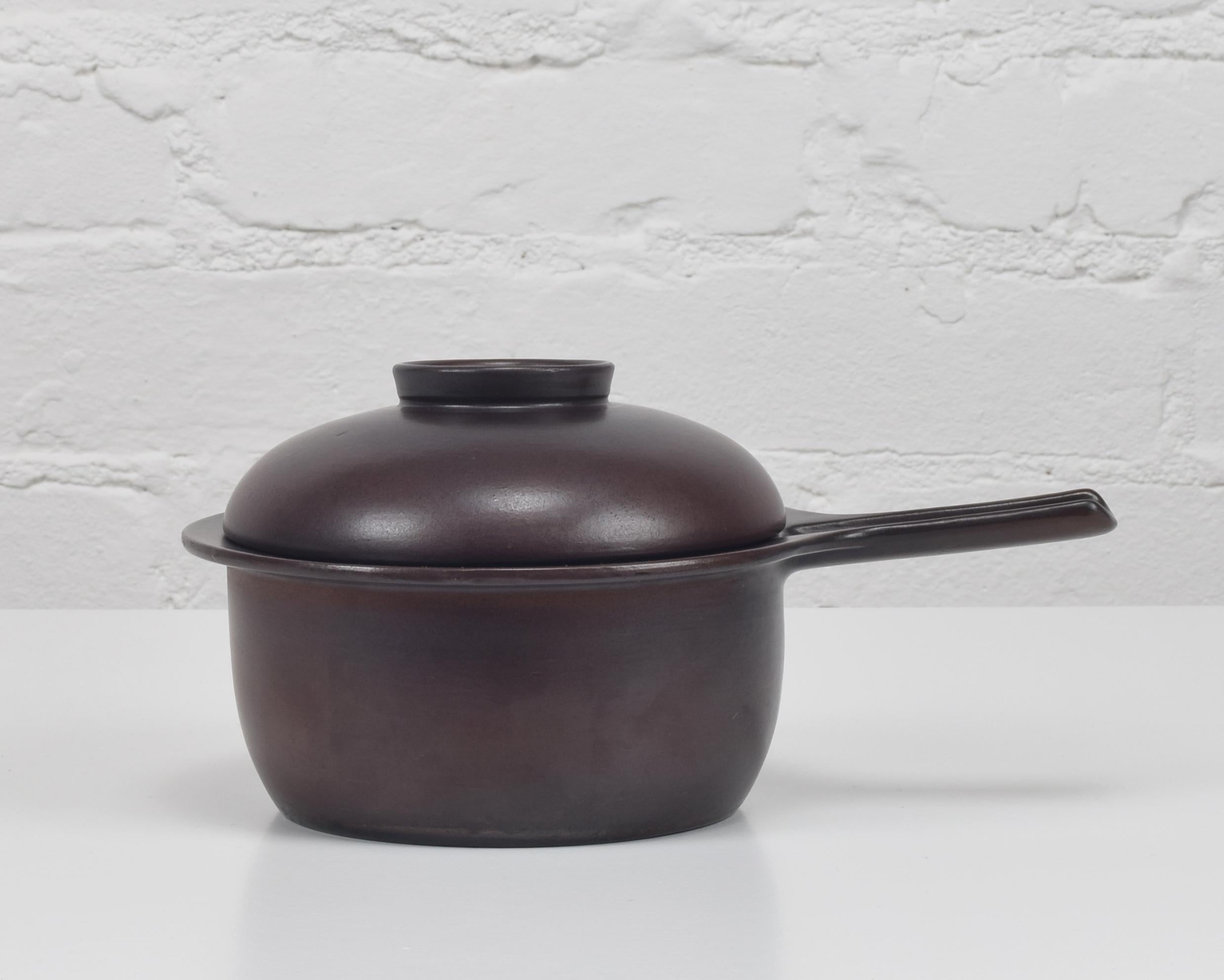 Ulla Procopé, Finland (designer/maker)

'Liekki' cooking pot & cover

Designed 1953, manufactured 1957-78
Stoneware with brown glaze
Super condition, appears unused.

L 24 cm, Di 17cm, H 12.5cm; Wt 770g