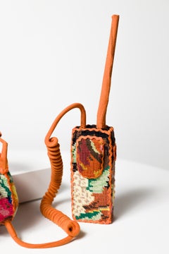 "Communication", floral needlepoint on vintage headphones and walkie talkie