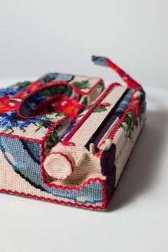 "Typewriter", floral needlepoint embroidery wrapped on a vintage typewriter
