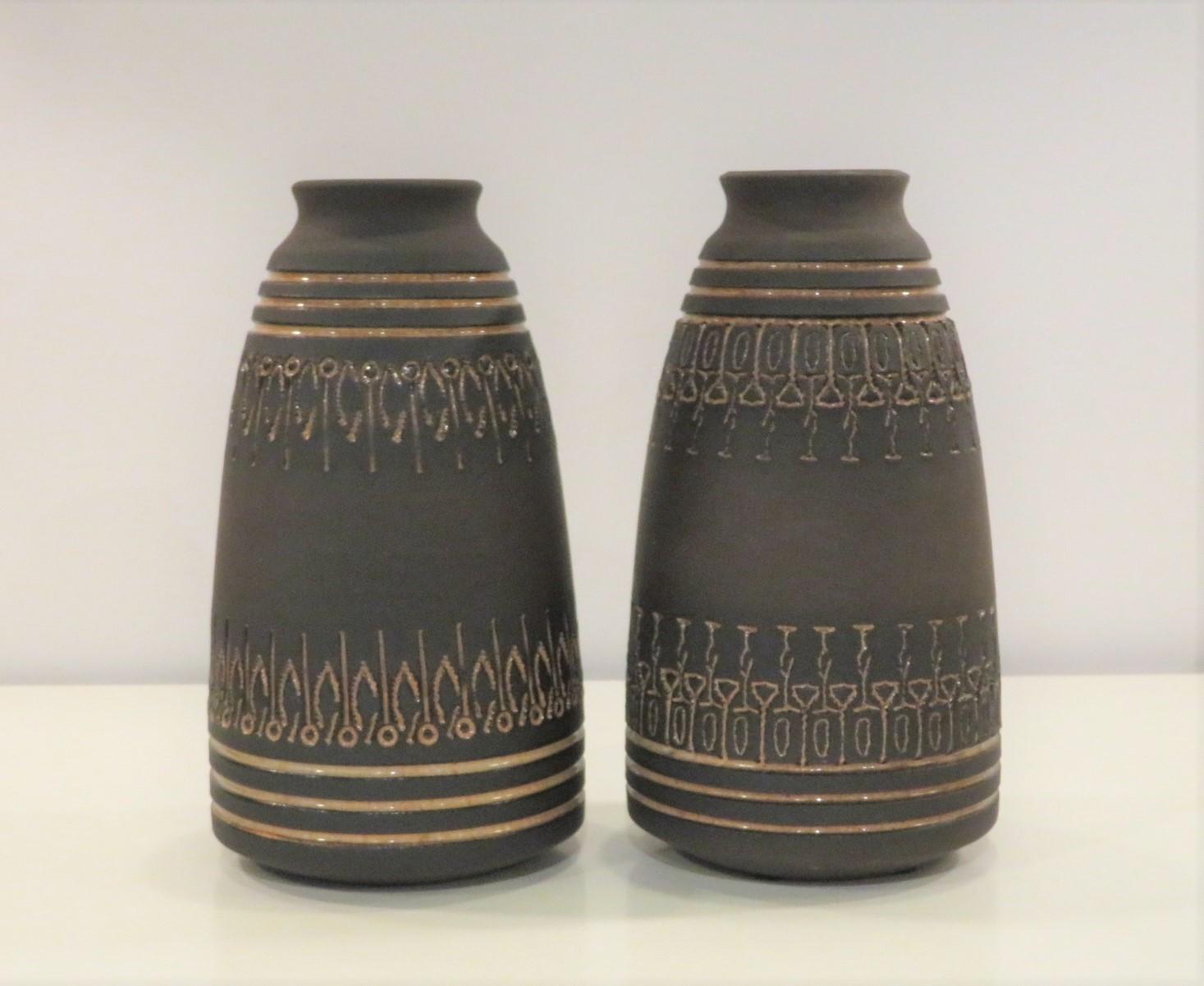 This grouping of 5 stoneware pieces by Ulla Winblad was produced from the late 50s (weed pot) through the early 1960s. These are all handmade unique pieces with sgraffito design. Three pieces are without a glaze, emphasizing the rustic feel of the