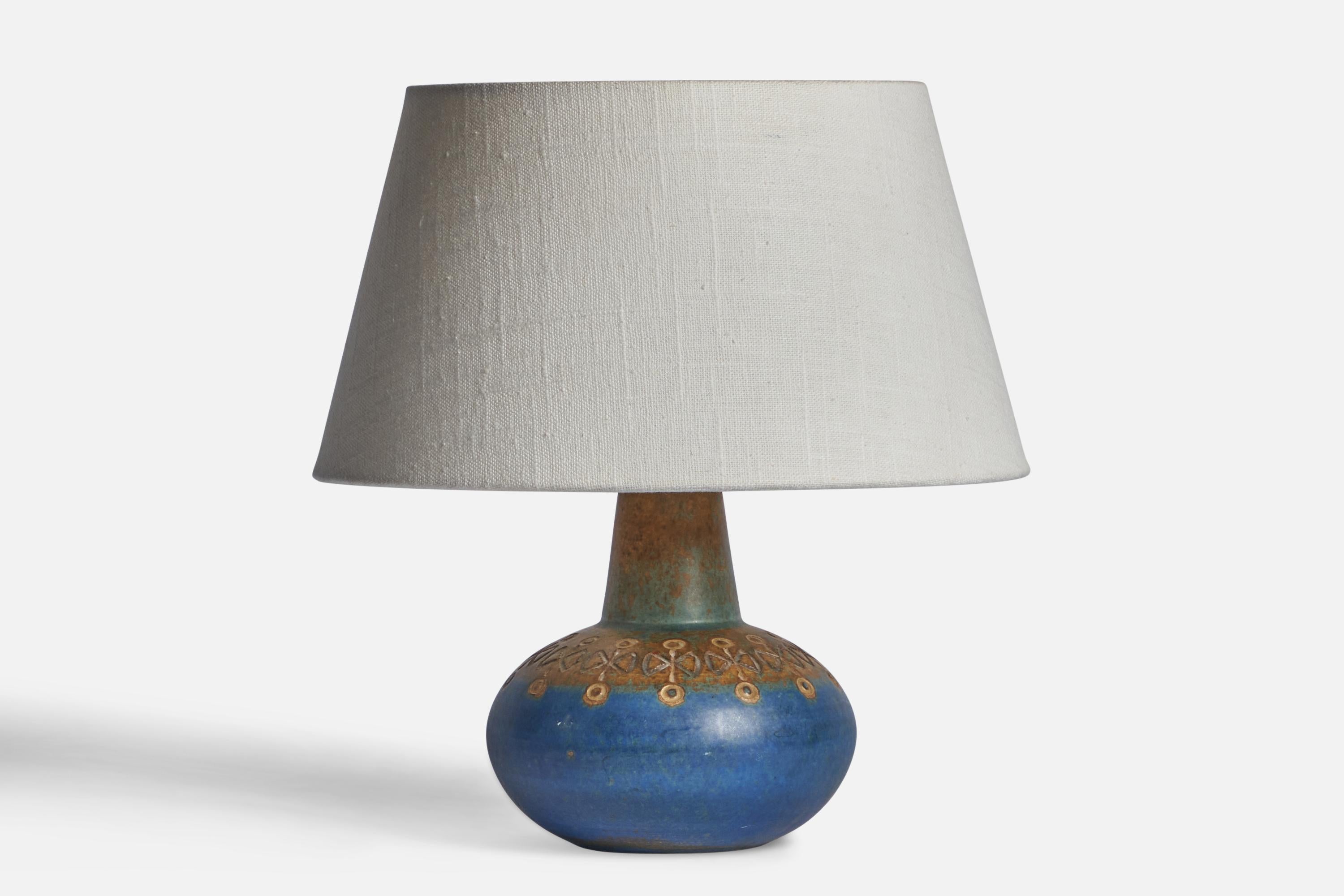 A blue and brown-glazed stoneware table lamp designed by Ulla Winbladh and produced by Alingsås Keramik, Sweden, 1960s.

Dimensions of Lamp (inches): 7.75” H x 5” Diameter
Dimensions of Shade (inches): 7” Top Diameter x 10” Bottom Diameter x