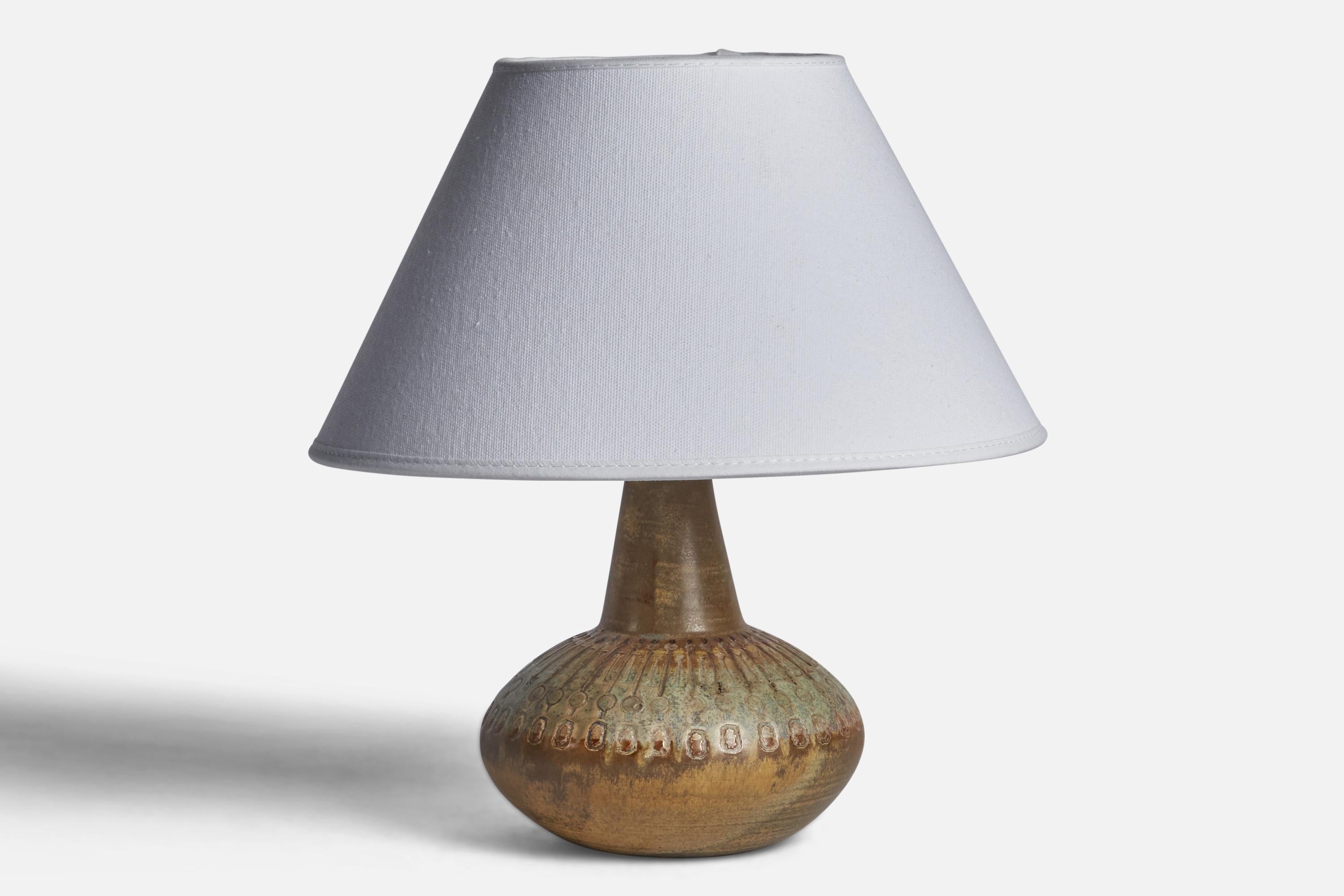 A green and brown-glazed stoneware table lamp, designed by Ulla Winbladh and produced by Alingsås Keramik, Sweden, 1960s.

Dimensions of Lamp (inches): 7.5” H x 5.5” Diameter
Dimensions of Shade (inches): 7” Top Diameter x 10” Bottom Diameter x