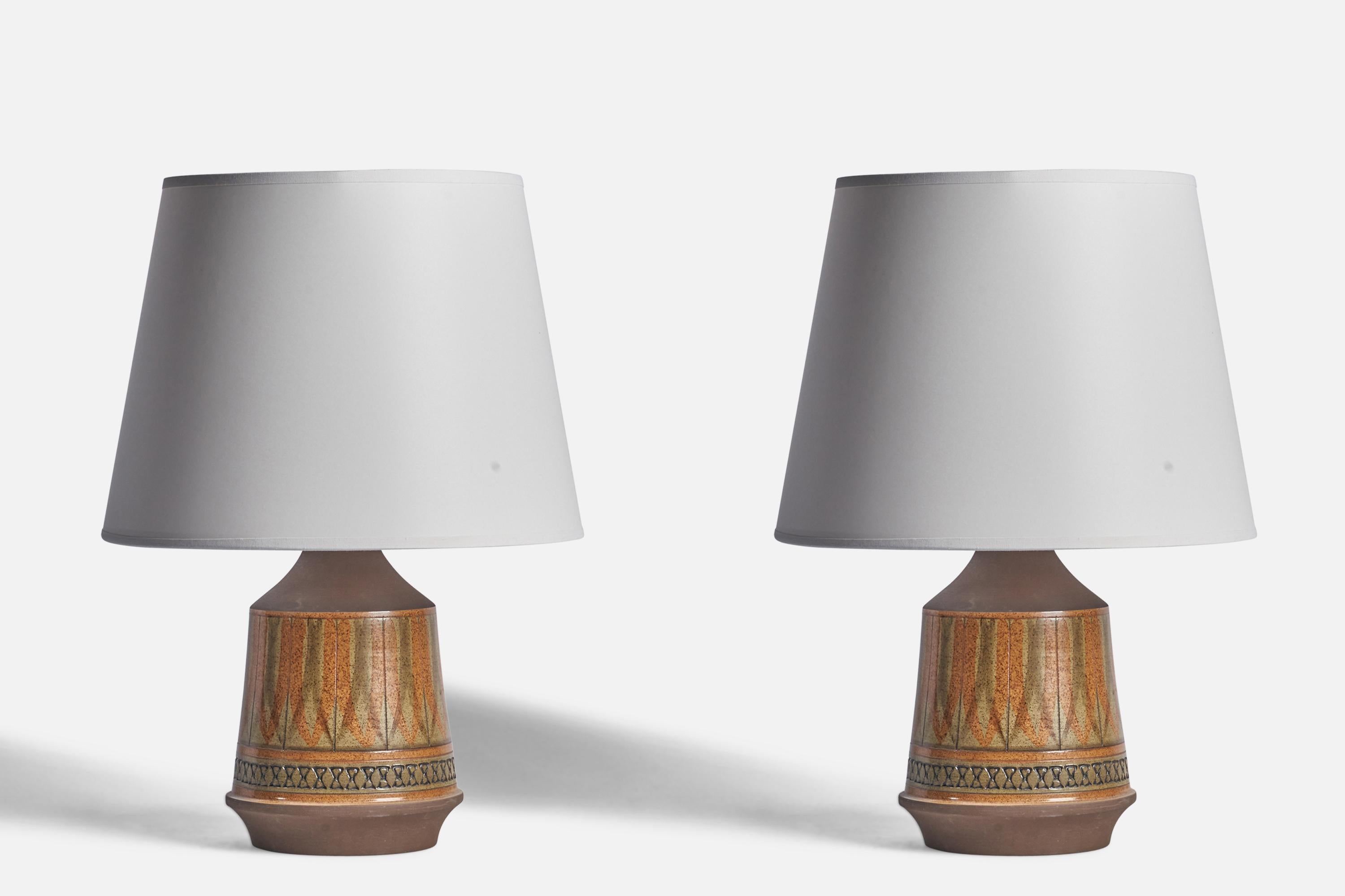 A pair of brown and beige-glazed table lamps designed by Ulla Winbladh and produced by Alingsås Keramik, Sweden, c. 1960s.

Dimensions of Lamp (inches): 11.25” H x 6” Diameter
Dimensions of Shade (inches): 9” Top Diameter x 12” Bottom Diameter x 9”
