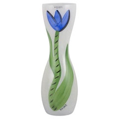 Ulrica Hydman Vallien for Kosta Boda. Tall and slender vase with flower.