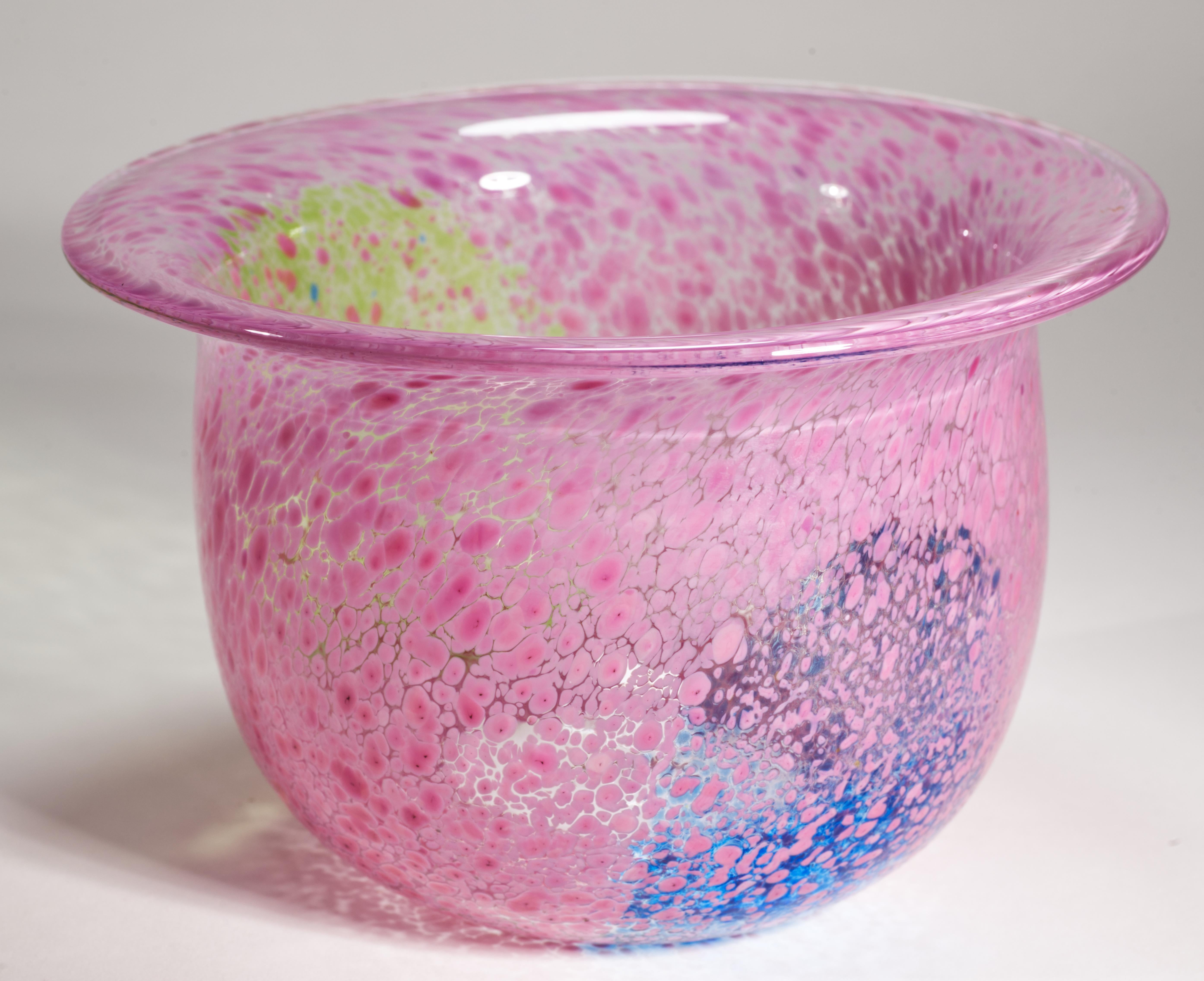  Colorful Scandinavian Modern vase with flared rim features speckled fused glass decor in light pink color with underlying color block accents in cobalt blue and pastel green on the lower half of vase. The vase was created as a part of Artis
