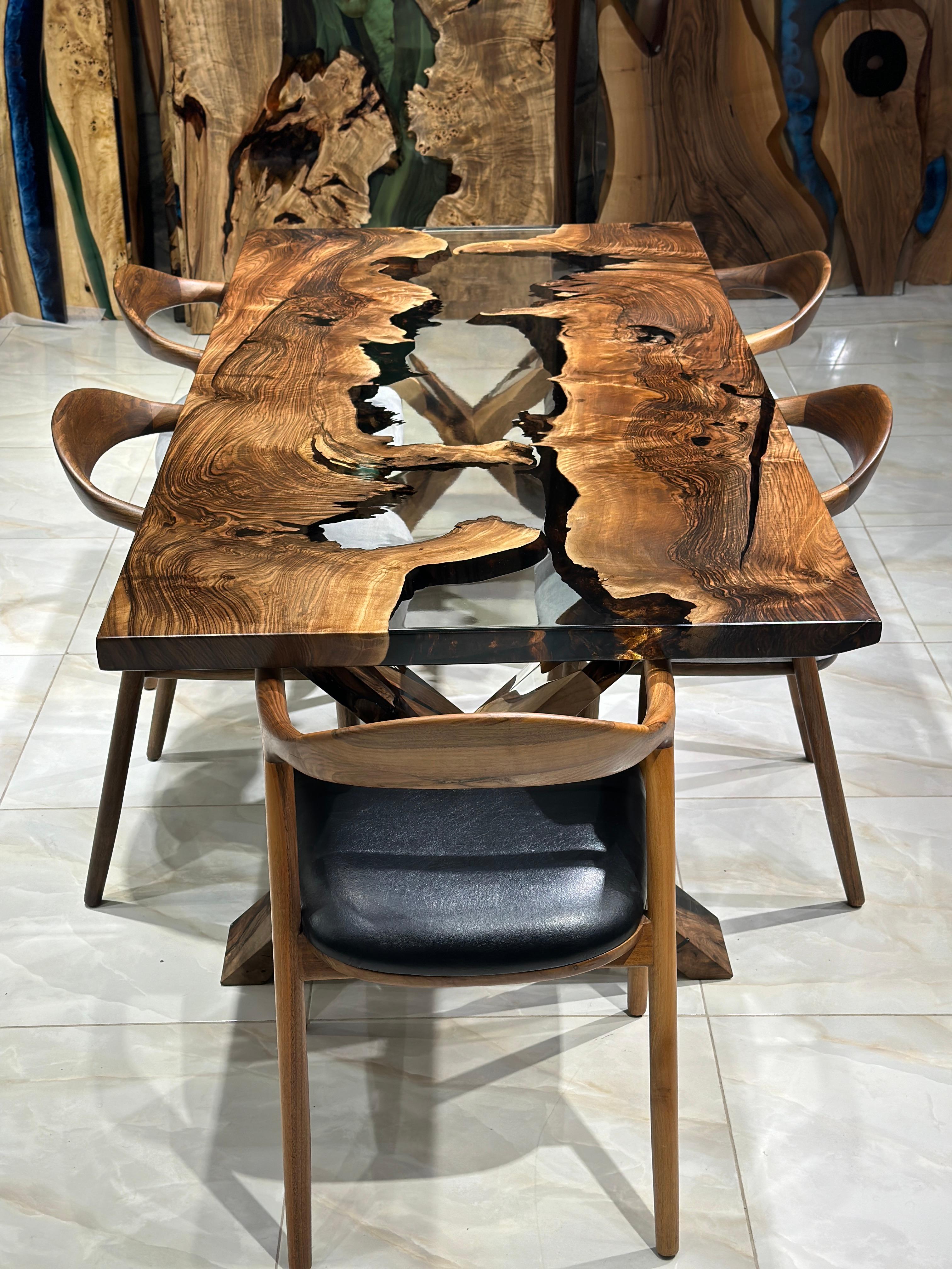 Walnut Live Edge Clear Epoxy Resin Dining Table 

This table is made of 500 years old Walnut Wood. The grains and texture of the wood describe what a natural walnut woods looks like.
It can be used as a dining table or as a conference table.