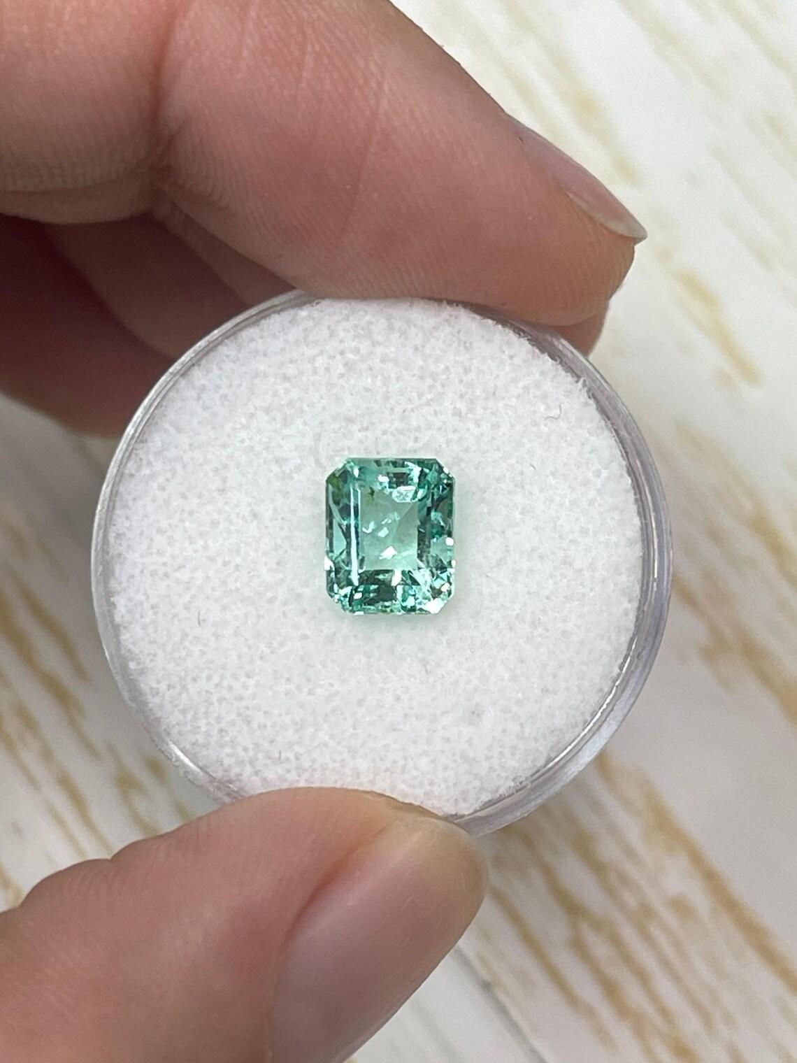 Stone: Emerald
Weight: 1.93-carats
Shape: Emerald Cut
Clarity: Transparent
Luster: Excellent
Color: Light Pastel Green
Measurements: 7.89mm x 6.52mm x 5.47mm
Geographic Origin: Colombia
Treatment: Natural, Oiling

Comments: Due to their growth