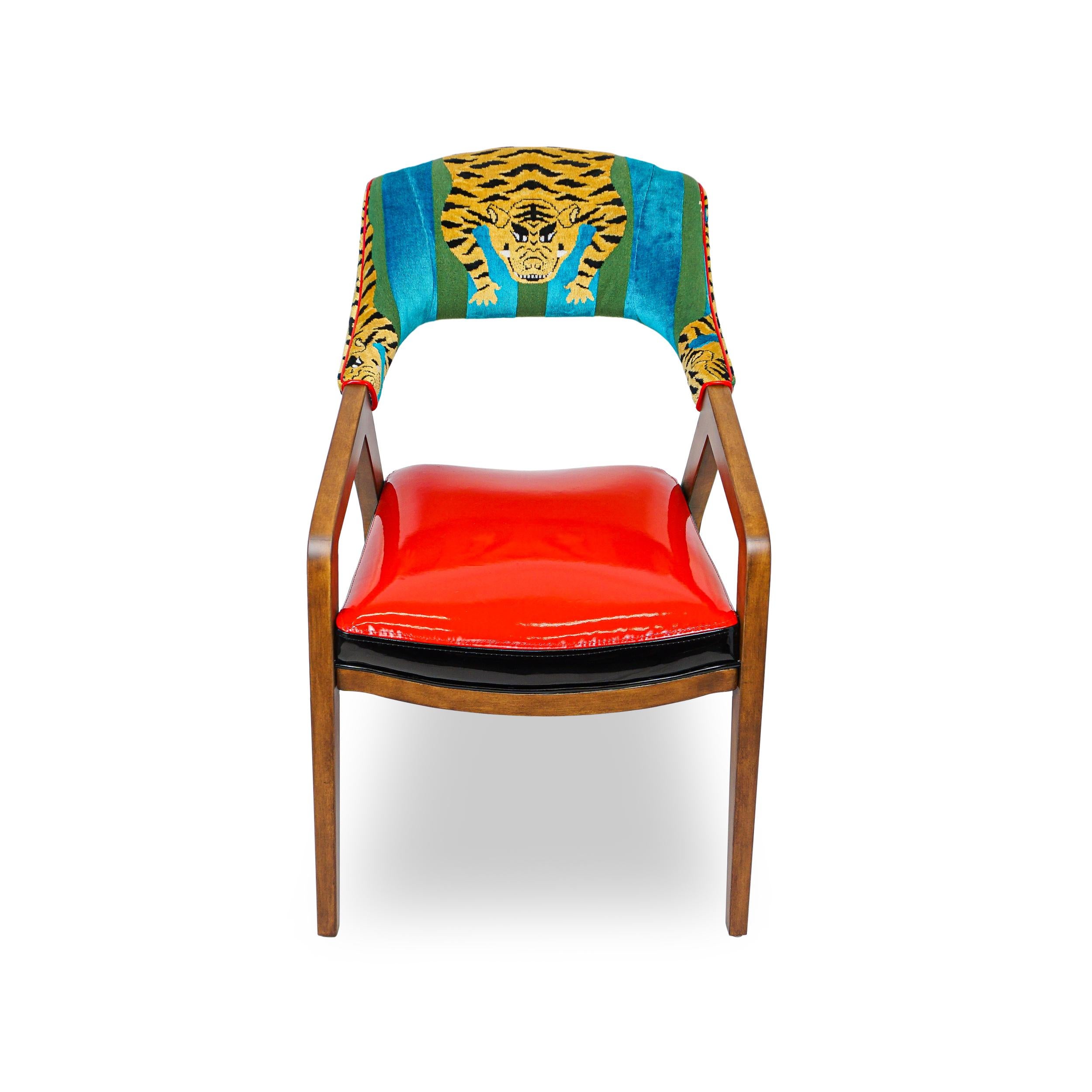 About this piece
Ultra modern frame with striking lines. Solid hard maple frame and carved details. As shown with red faux patent leather back and iconic Schumacher tiger velvet seat.

How we work
Made to order by Connecticut-based furniture design