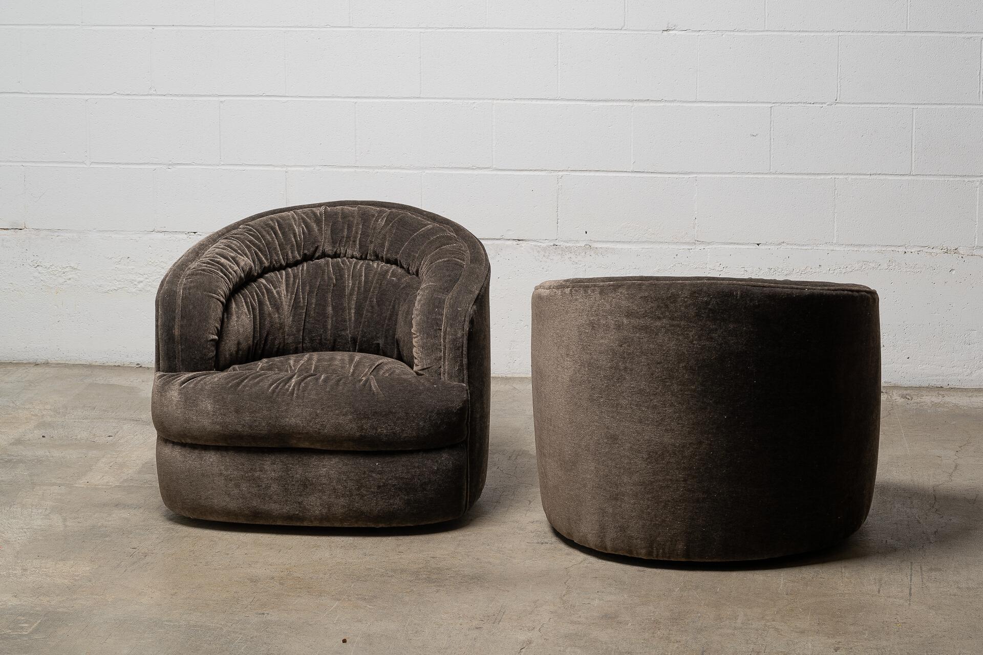 Looking for a pair of vintage chairs that no one else has? Meet your match. This ultra-rare pair of 1960s swivel chairs by Selig has been freshly reupholstered in a top-quality, dark colour velvet that’s as rich and decadent as it looks. The