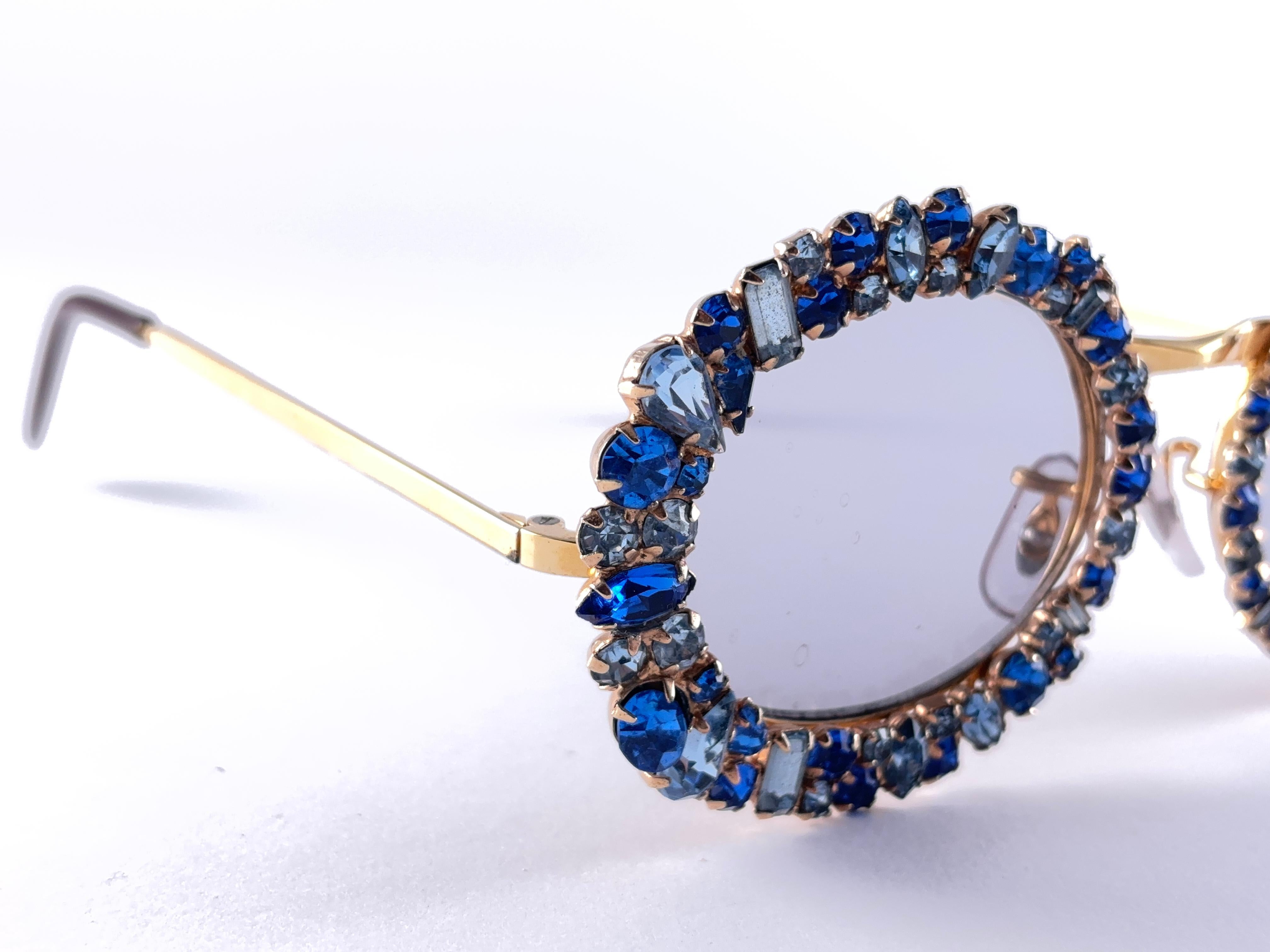This Is A Seldom And Rare Piece Not Only For Its Aesthetic Value But For Its Importance In The Sunglasses And Fashion History.   
Delicate Enamel Ornamented Cast Gold Iron Filigree Adorned  With Different Shaped Cristals Frame. We Have The Privilege