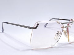 Rarísimas gafas de sol Tura de los años 70 sin montura, plateadas y con lentes translúcidas