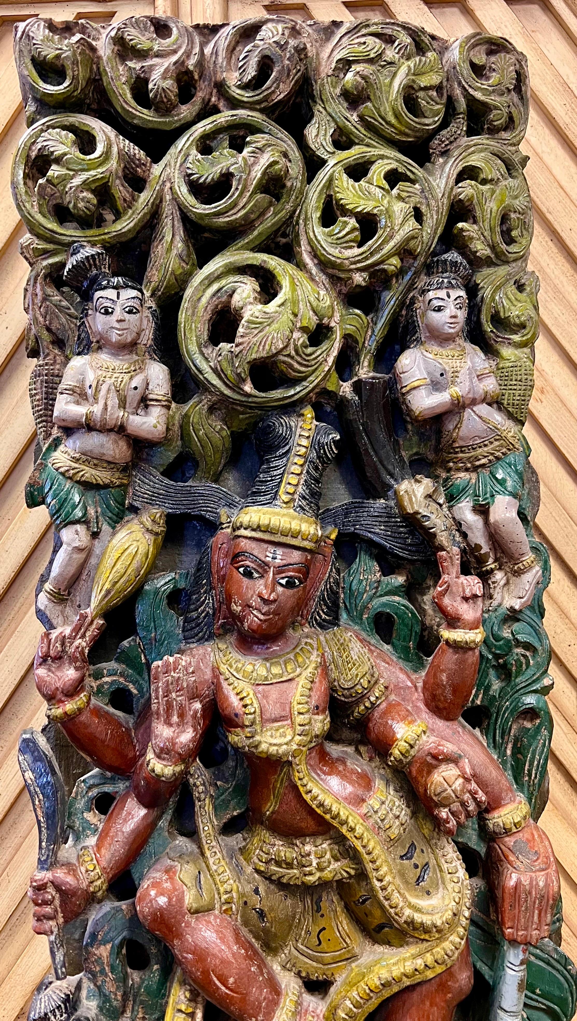 One of a kind antique carved wall sculpture. Weighs 35lbs is ready to hang with a height of 70 inches. The detail of the intricate carvings is next level. It features intricate carvings including three large multi-armed Hindu gods/goddesses