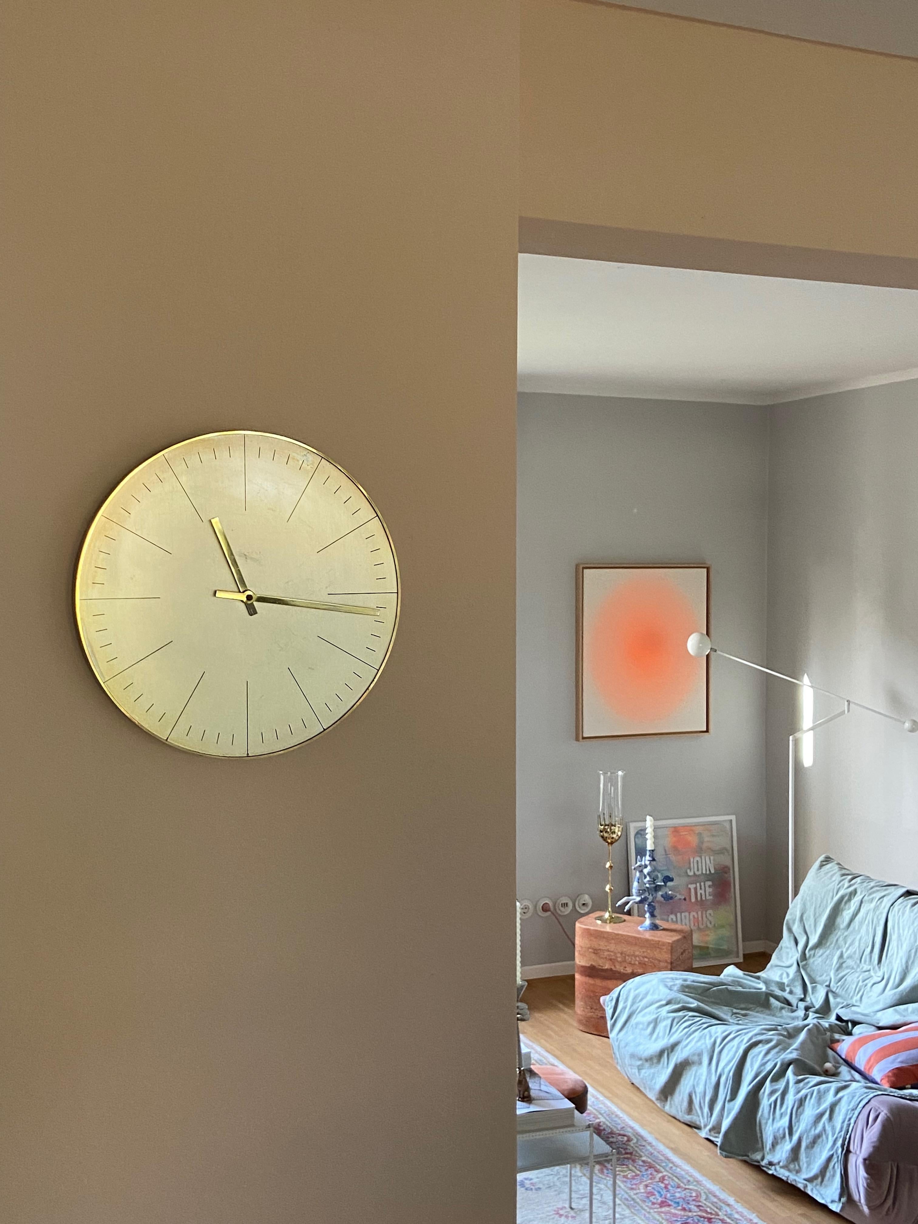Wall clock design by Max Bill for Junghans in 1960s. Brass metal case. Electric movement is in good working condition. At the back side maybe from the owner or clockmake a repair note. Nice vintage condition with patina. Condition please see