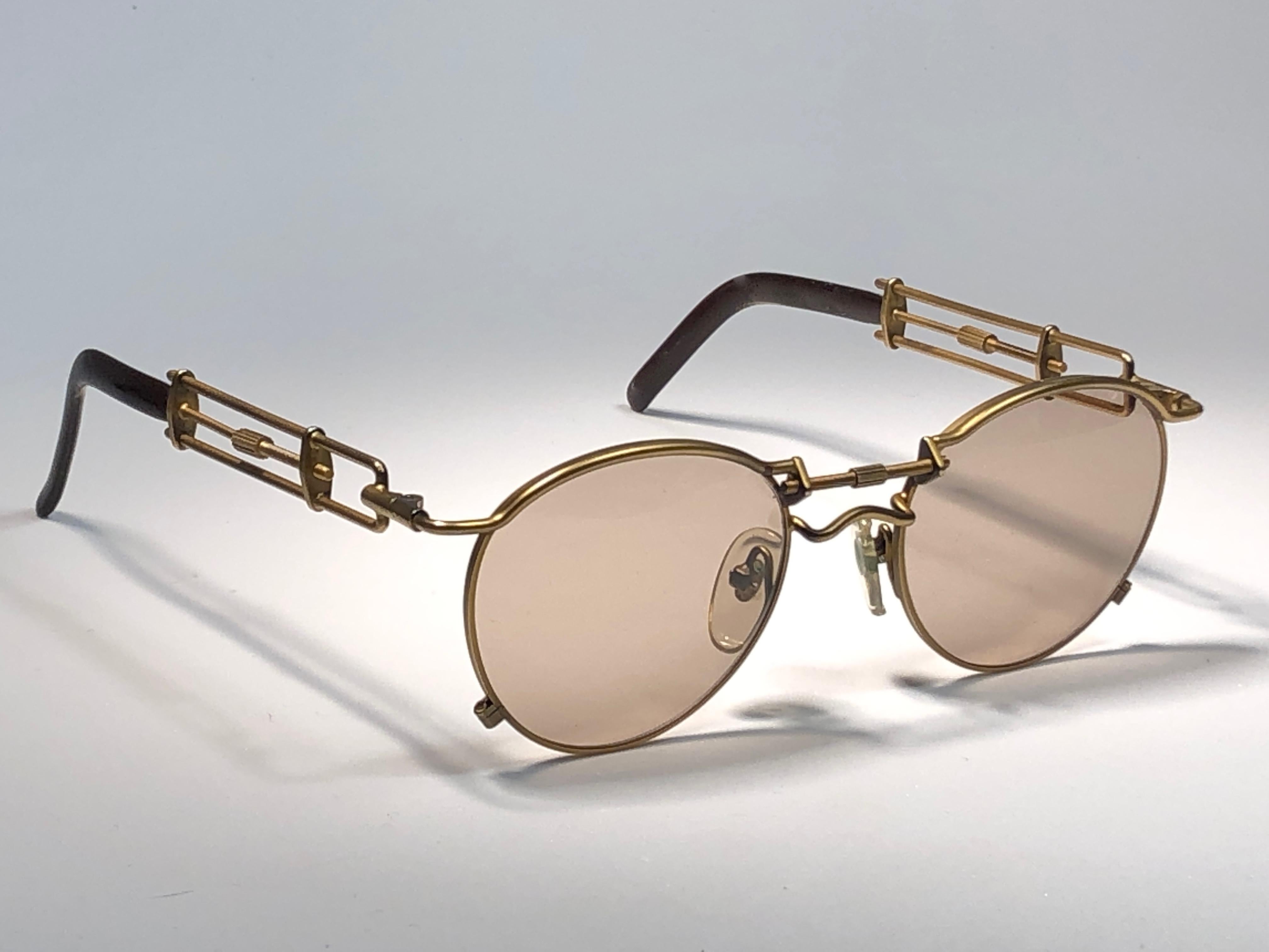 Ultra rare in this color Jean Paul Gaultier 56 0174 Copper Details frame. 
Light brown lenses that complete a ready to wear JPG look.

Amazing design with strong yet intricate details.
Design and produced in the 1900's.
Minor sign of wear due to
