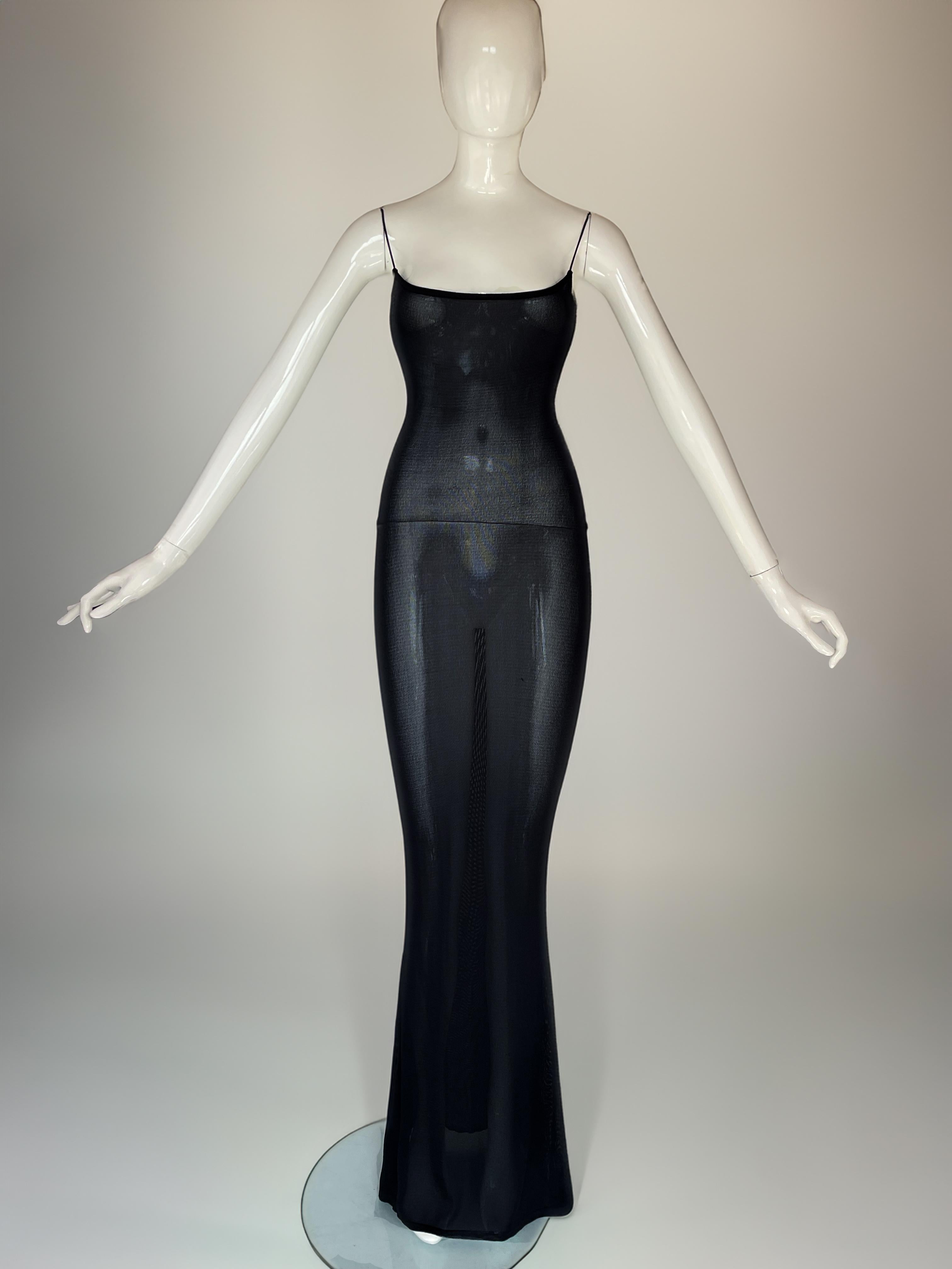 Super rare early 1994 John Galliano slip dress

Construction: Heavy, high-quality knit, bias-cut to accentuate movement.

Silhouette: Sleek, full-length slip dress with fitted body-con fit.

Straps: Delicate spaghetti shoulder straps, elegant