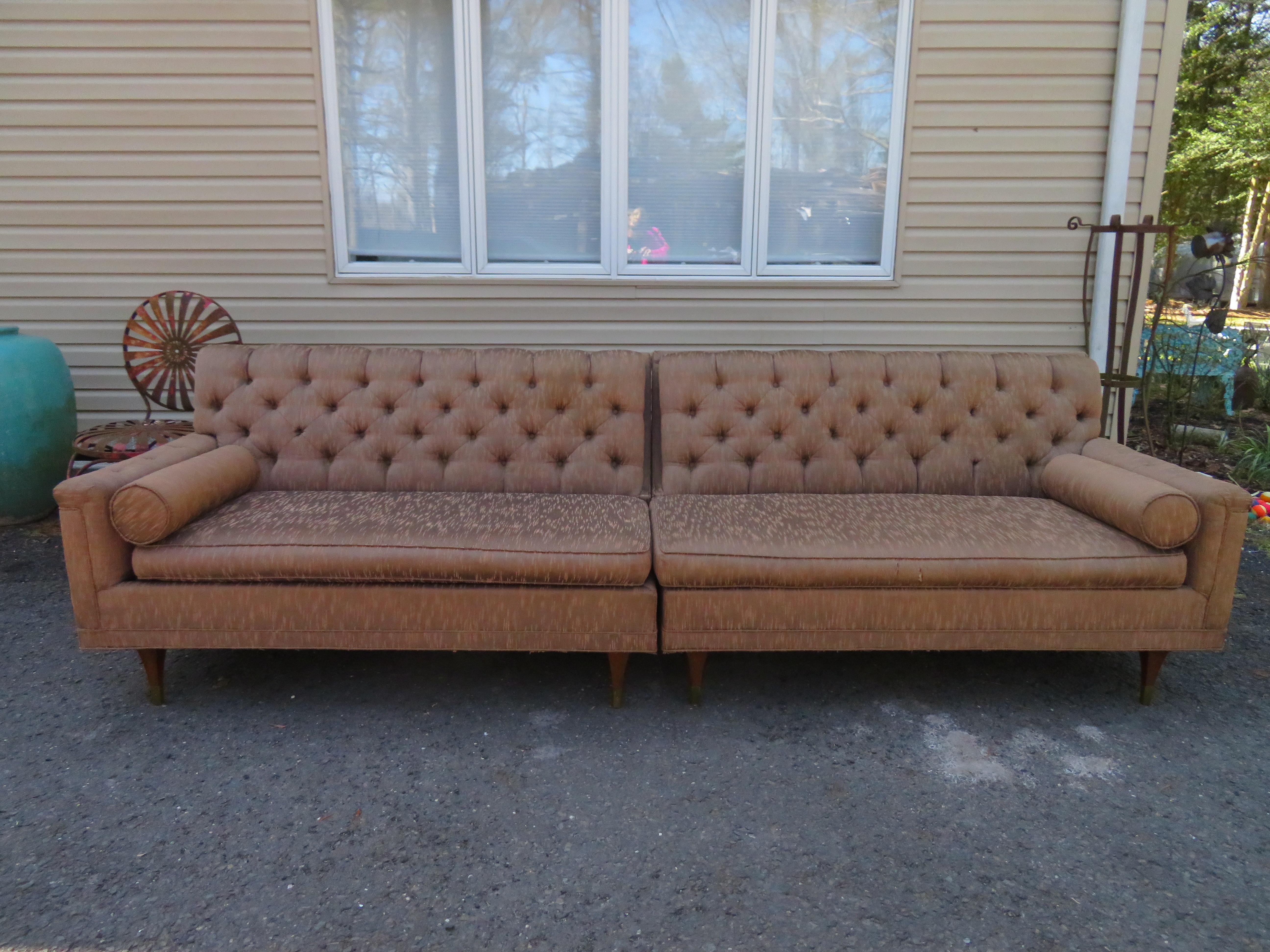 Ultra rare Karpen of California tufted back 2 piece sofa sectional. This super sexy sofa can be used as an L-shaped sectional or all lined up as a long sofa. We just flipped over the wonderful modern walnut legs with brass sabots-see photos. This