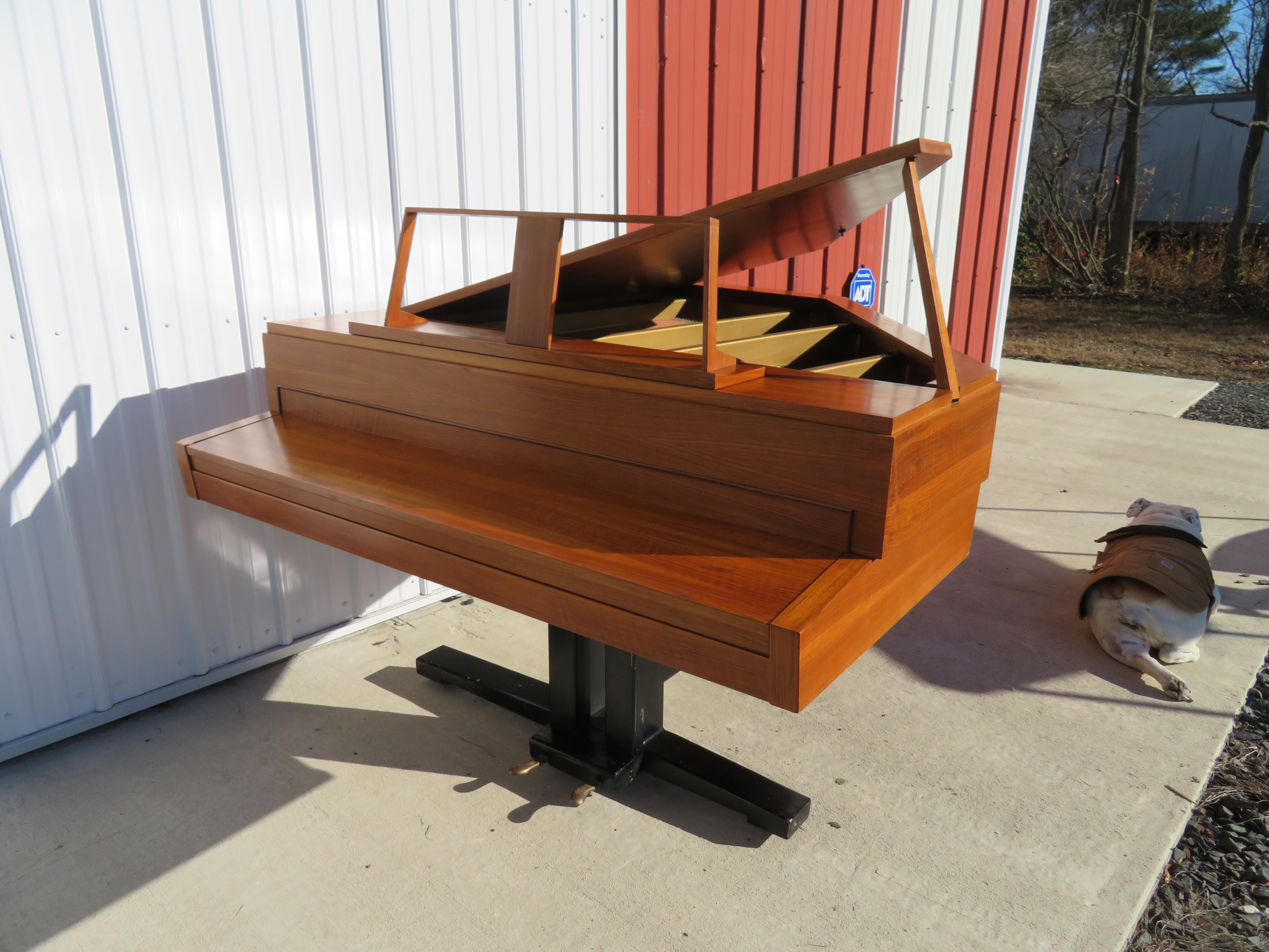 Rippen Pianos of the Netherlands were well respected for their high-quality instruments of unique designs and materials. Nico Rippen designed this folding piano as a design that could be shipped for less cost and moved into smaller homes. The pianos