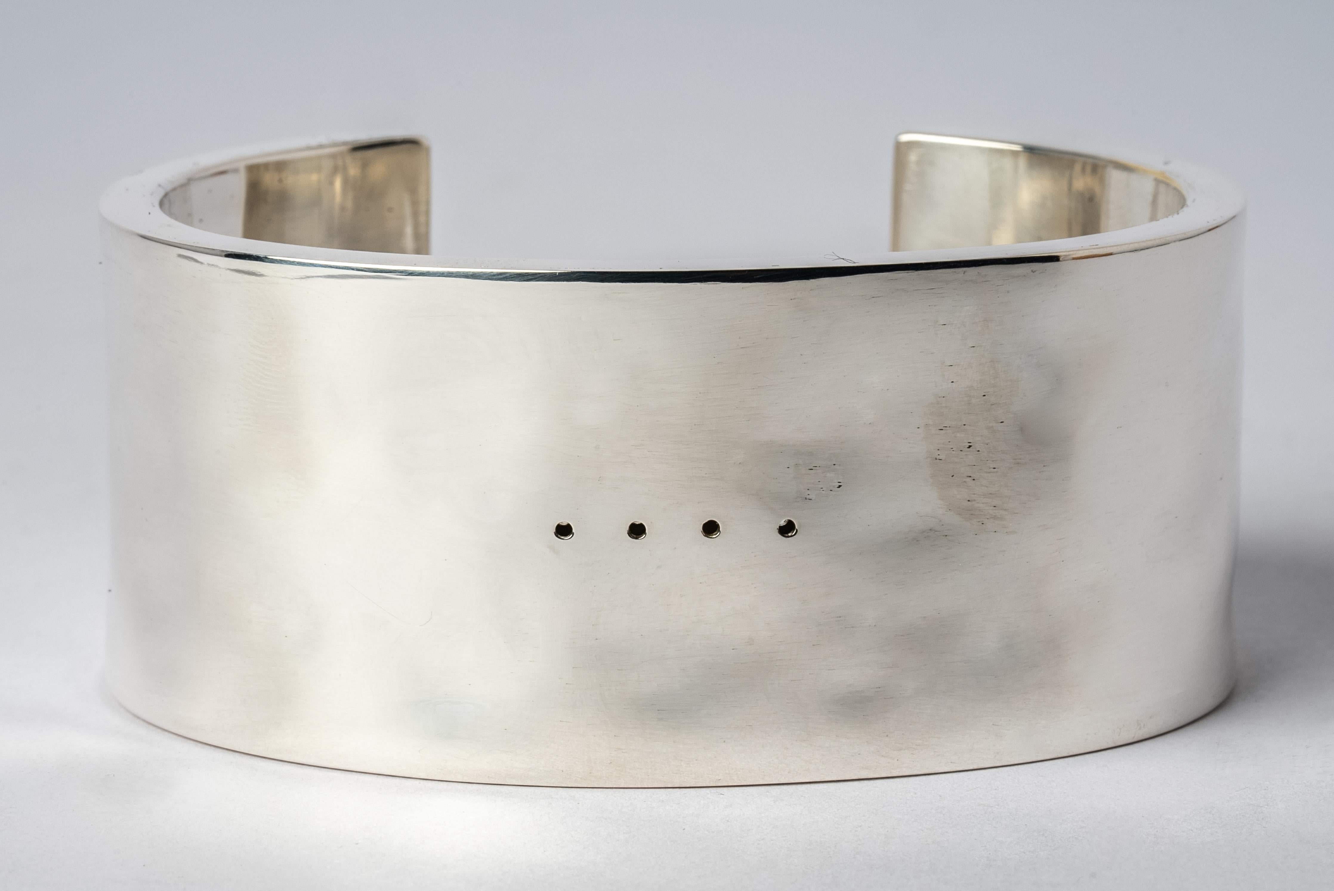 Bracelet in polished silver plated brass. This piece is 100% hand fabricated from metal plate; cut into sections and soldered together to make the hollow three dimensional form. If sterling silver, the sheet metal is made by hand. The silver is