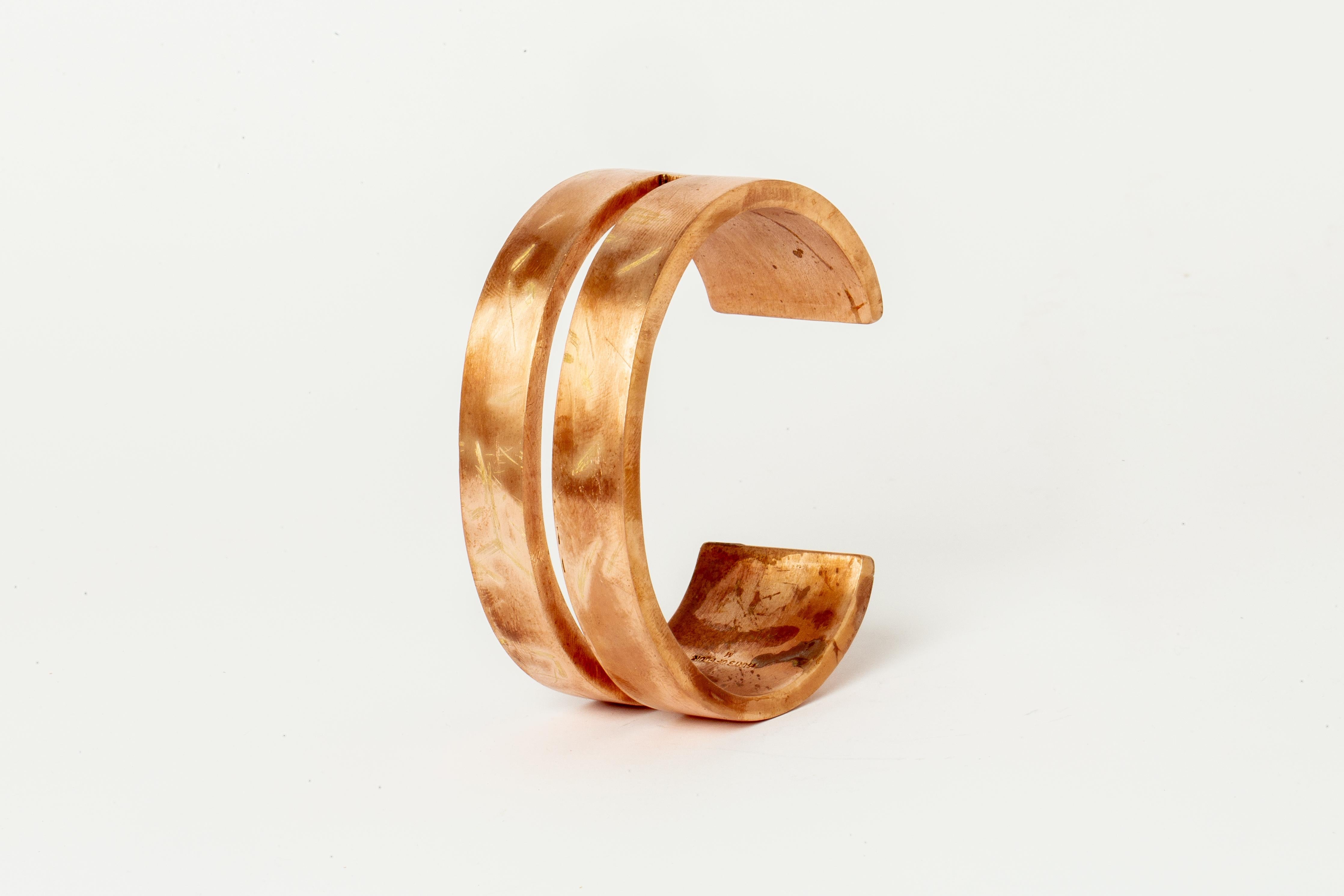 Bracelet in brass. Brass substrate is electroplated with 18k Rose Gold and then dipped into acid to create the subtly destroyed surface. This piece is 100% hand fabricated from metal plate; cut into sections and soldered together to make the hollow
