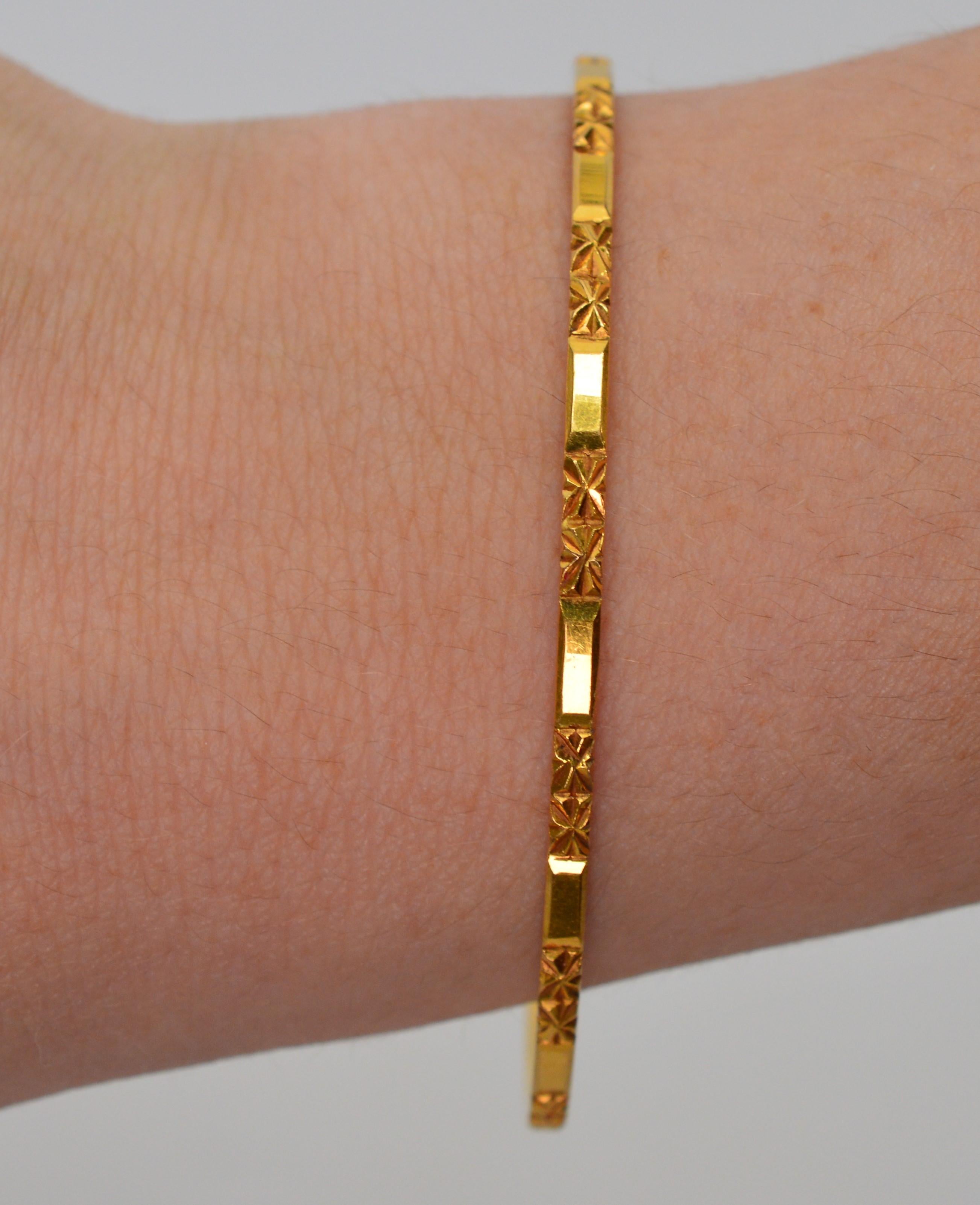 This simple but elegant eighteen karat 18K yellow gold bangle bracelet is sure to get compliments.  Stylishly slim and lends just the right touch of gold to any look. Measures 2-3/8 inches in diameter, made for smaller wrists. Inside circumference