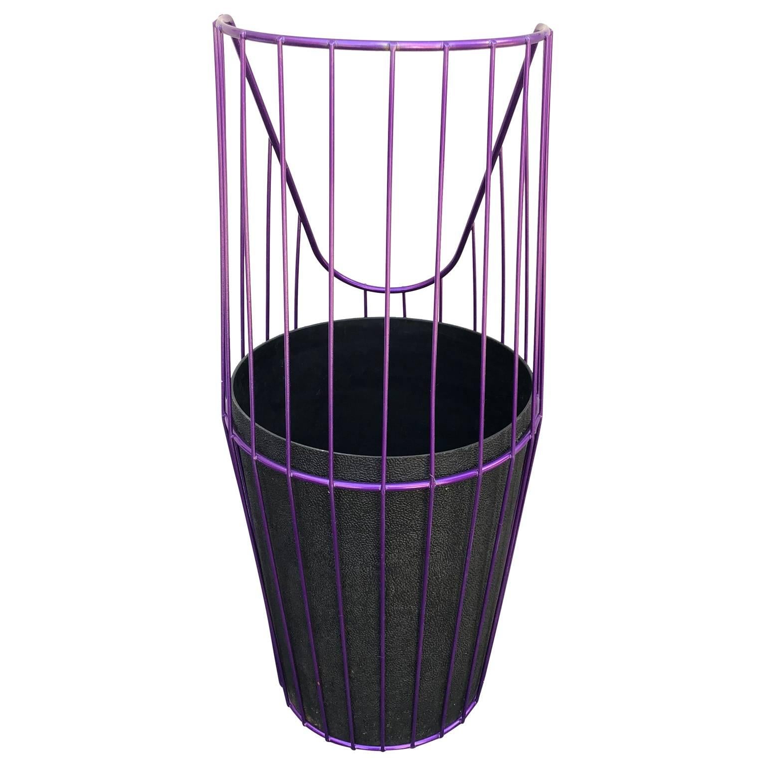 Painted metal wire wastebasket. Newly powder coated in bold ultraviolet this wastebasket is a little statement maker in your office! Happy to capture your rubbish, this trash can adds a fun touch to any area of your home. 