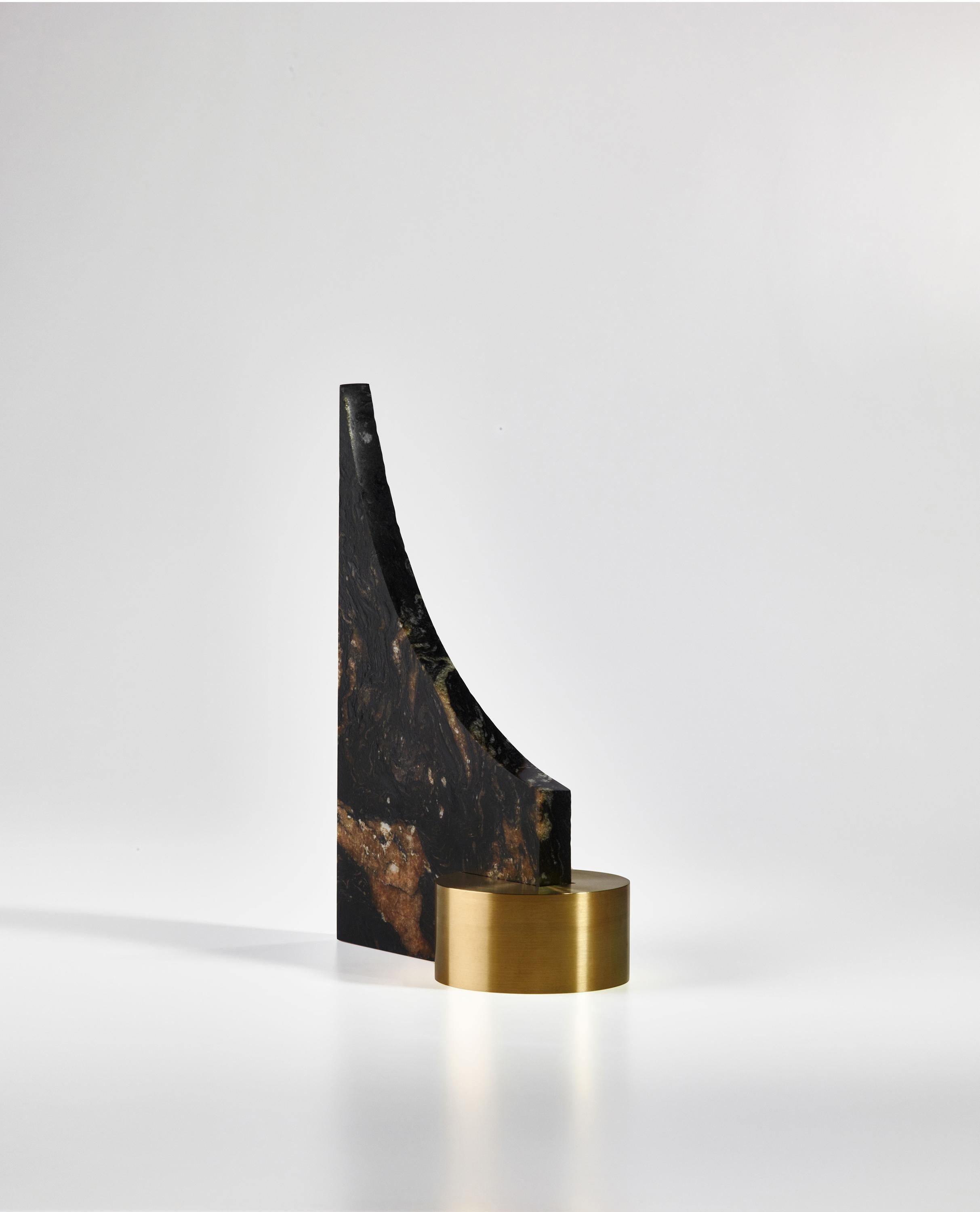 One of three new collection pieces created by the young French designer from Bordeau, William Guillon, Ultraviolence is a bookend composed of a 2 cm thick plate of Barocco granite and a split cylinder of solid brass. The stone is polished shiny on