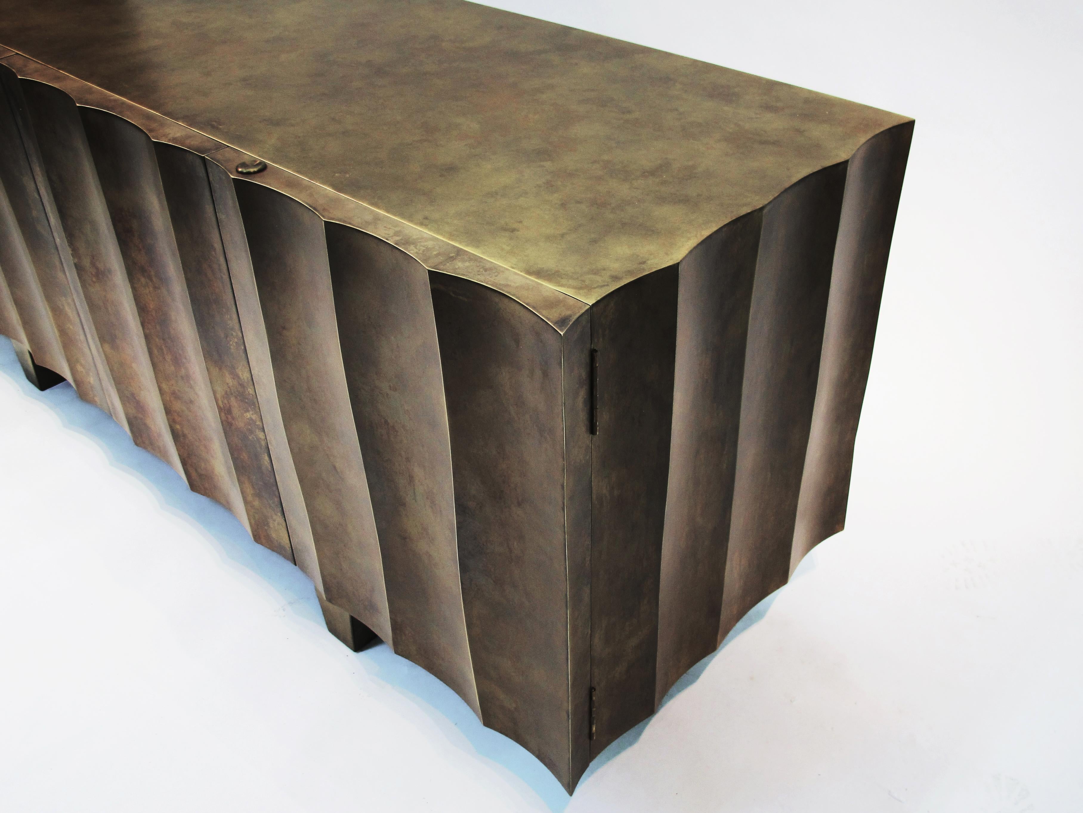 Uluwatsu sideboard- Signed by Stefan Leo
Forged iron, Top marble
Brass, patinated 
200 x 50cm, H:74 cm

Atelier Stefan Leo has a remarkable reputation thanks to its unique furniture designs created with the finest craftsmanship, proving how