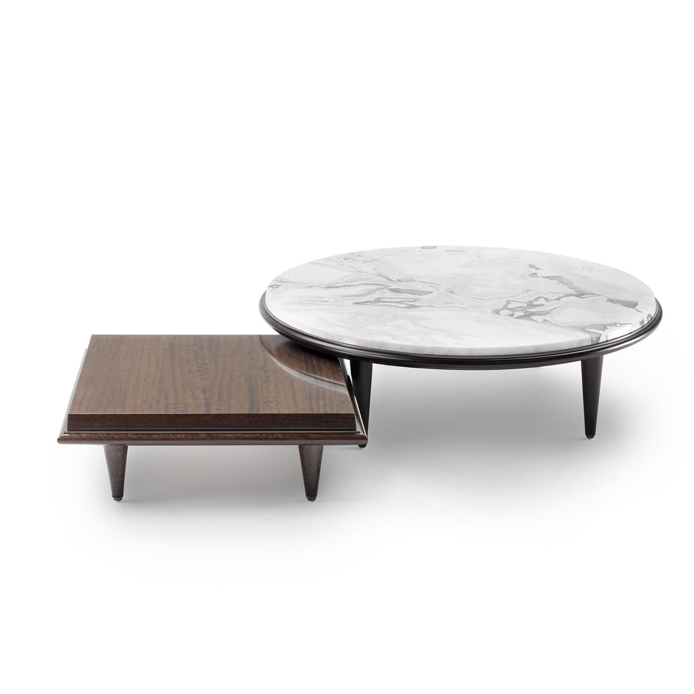 The sleek silhouette defining this coffee table harmoniously fits in a wide variety of contemporary interior decors. Resting on three tapered wooden legs with a eucalyptus-stained finish, this sophisticated design features a sturdy round white Dover