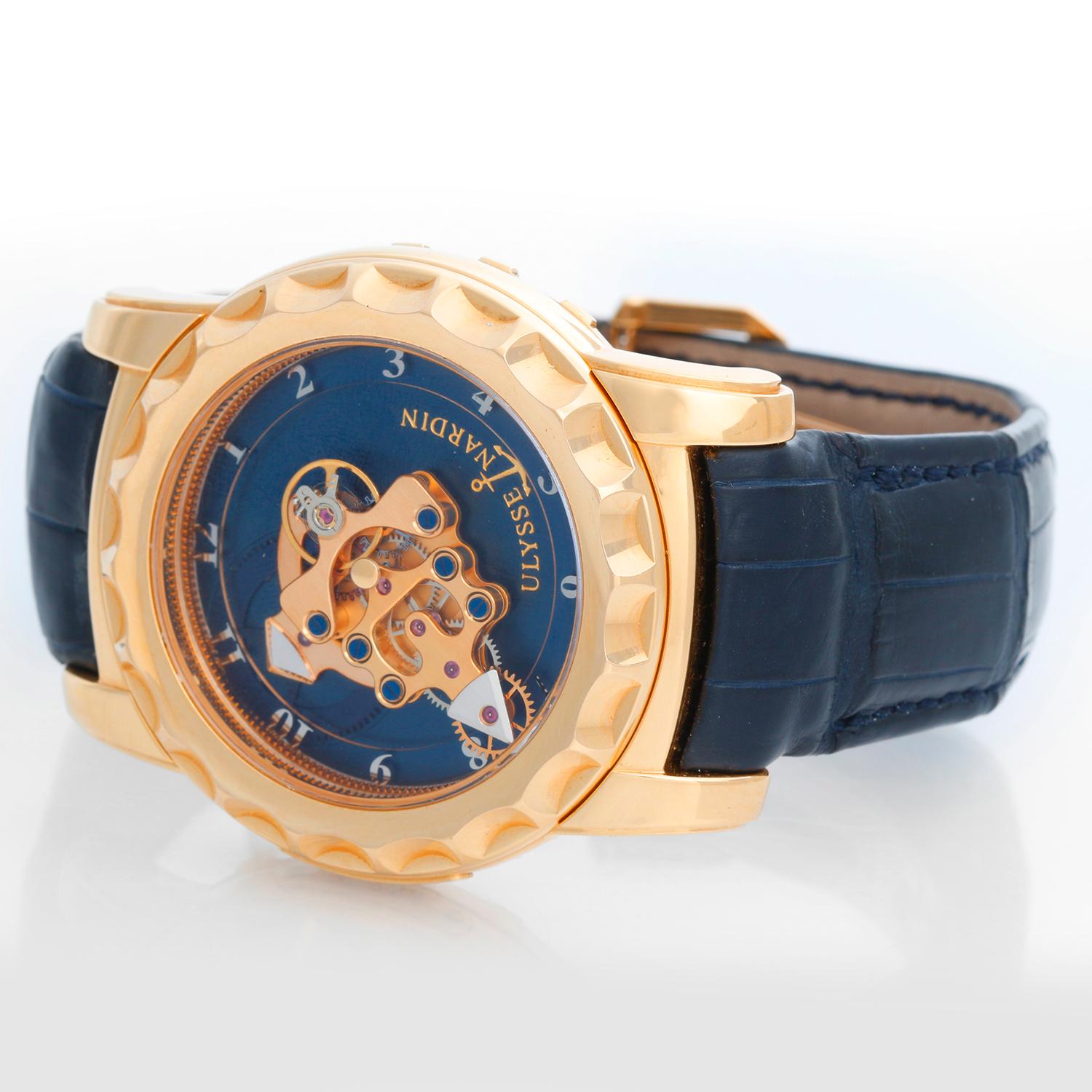 Ulysse Nardin Freak 18K  Yellow Gold Men's Watch 016-88 - Manual wind movement with 7 Day Power Reserve. 18K Yellow gold  ( 42.5 mm ) The watch is wound by the bezel. Blue dial; The actual movement acts as the hand. Blue alligator strap with