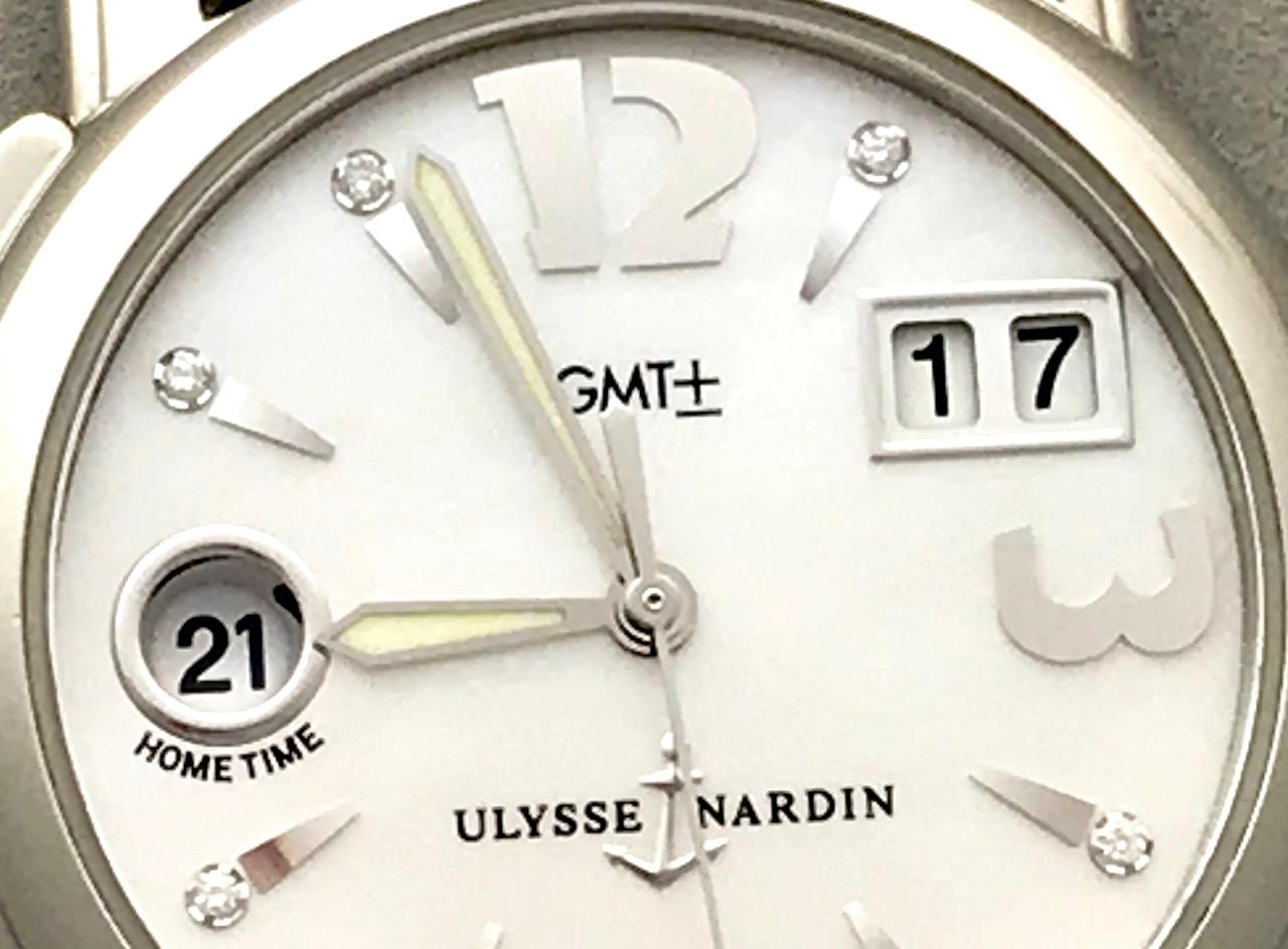 This beautiful pre-owned Ulysse Nardin GMT features a Home display as well as Big Date display. The movement is the caliber UN-22. Which is an automatic winding twenty-nine jewel movement. The dial is a gorgeous mother of pearl finish with polished