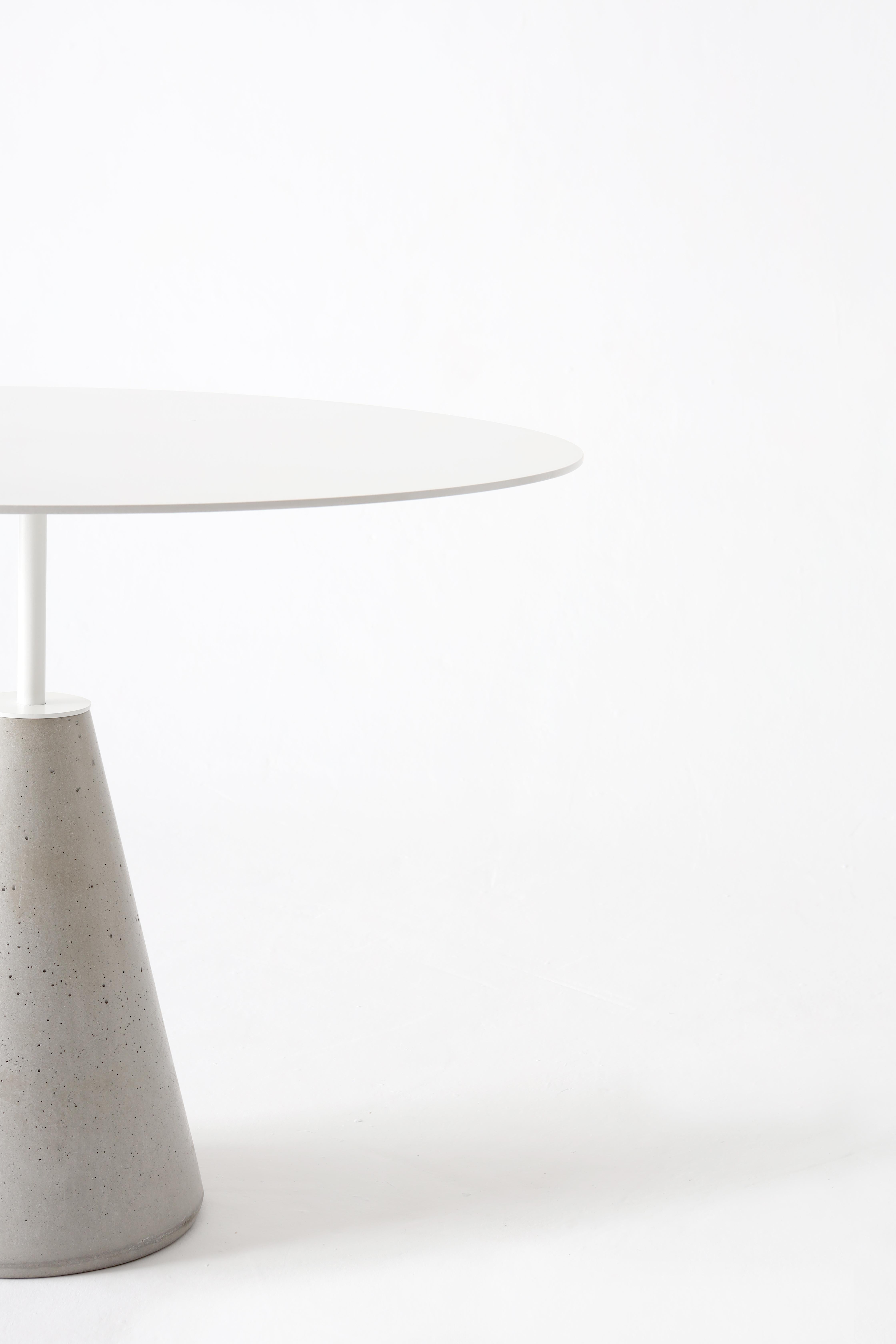 Table with concrete base and carbon steel top with electrostatic paint in black or white