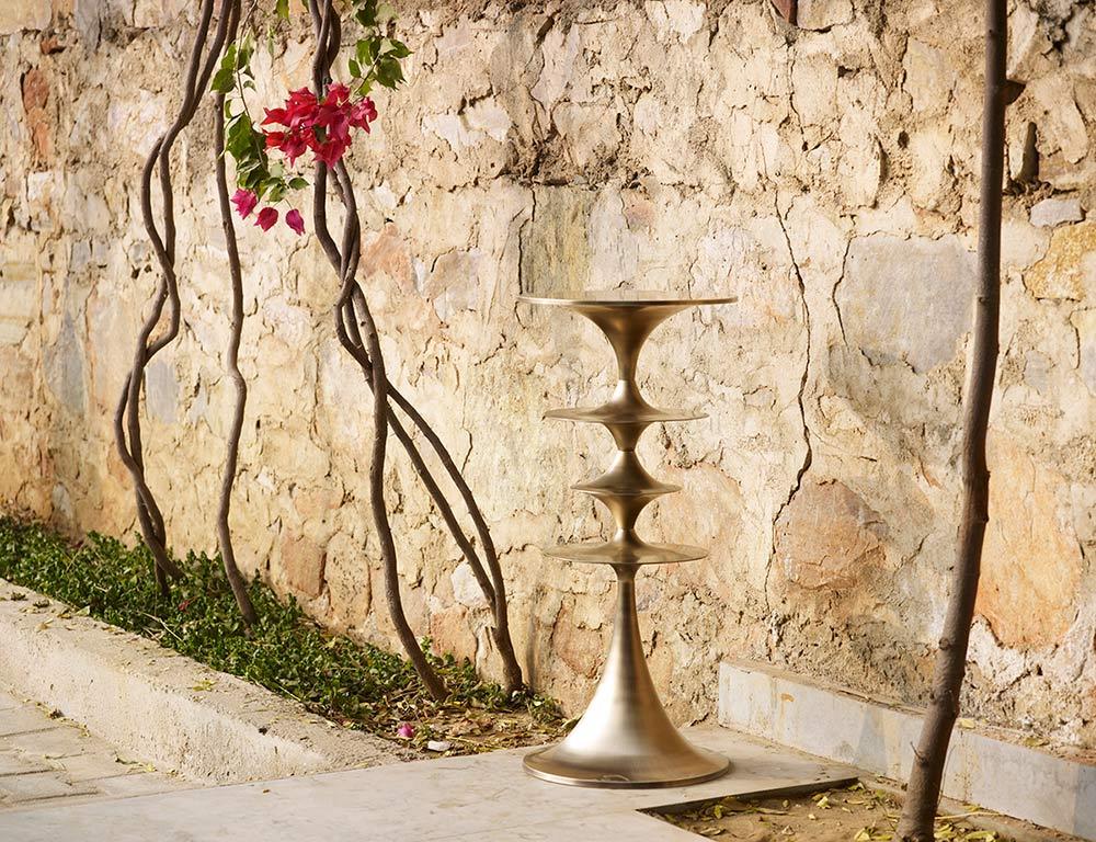 These sturdy, versatile cast brass occasional tables are modular and can be configured for different heights and profiles. Available in 26