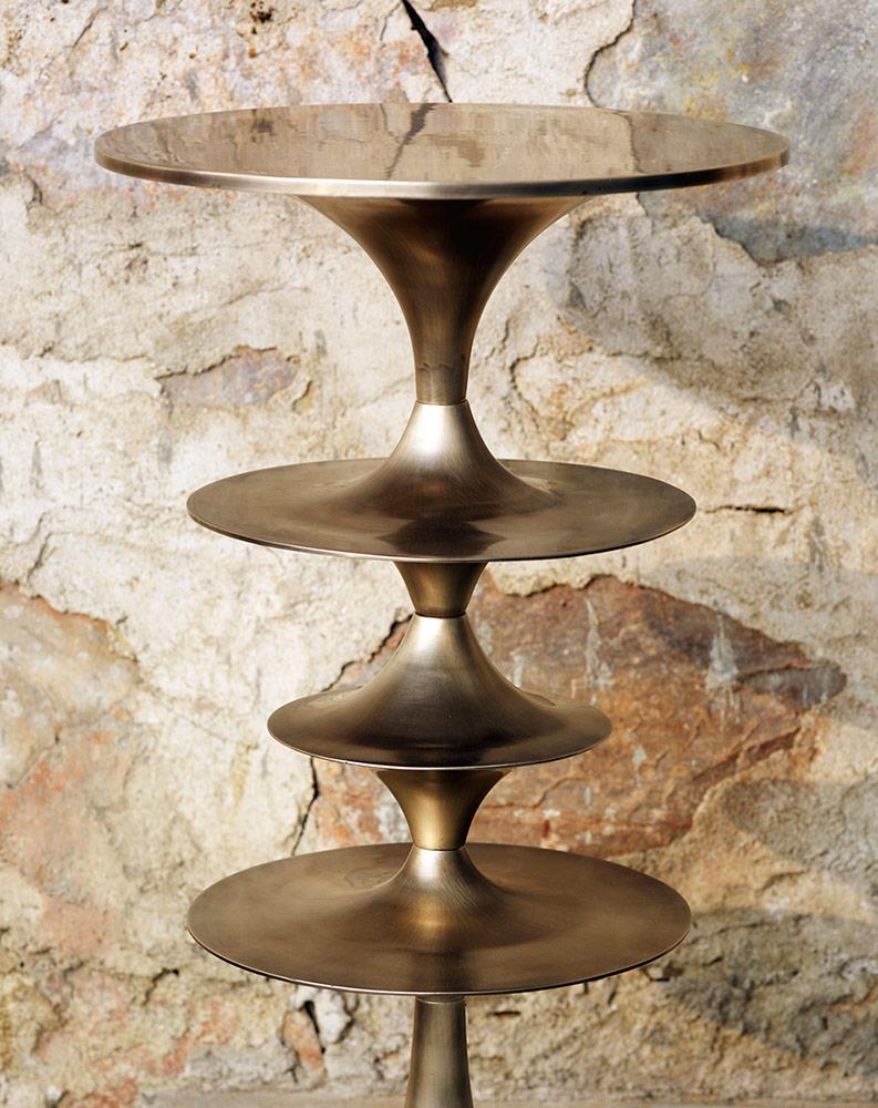 These sturdy, versatile cast brass occasional tables are modular and can be configured for different heights and profiles. Available in 26