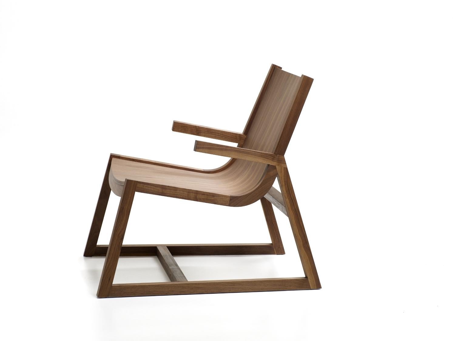 The Umber chair is a comfortable modern walnut armchair with crafted arm design detail. Designed to sit comfortably in its own space, the Umber chair offers a low, laid-back sitting position for relaxed enjoyment. Perfect as a wooden easy chair for