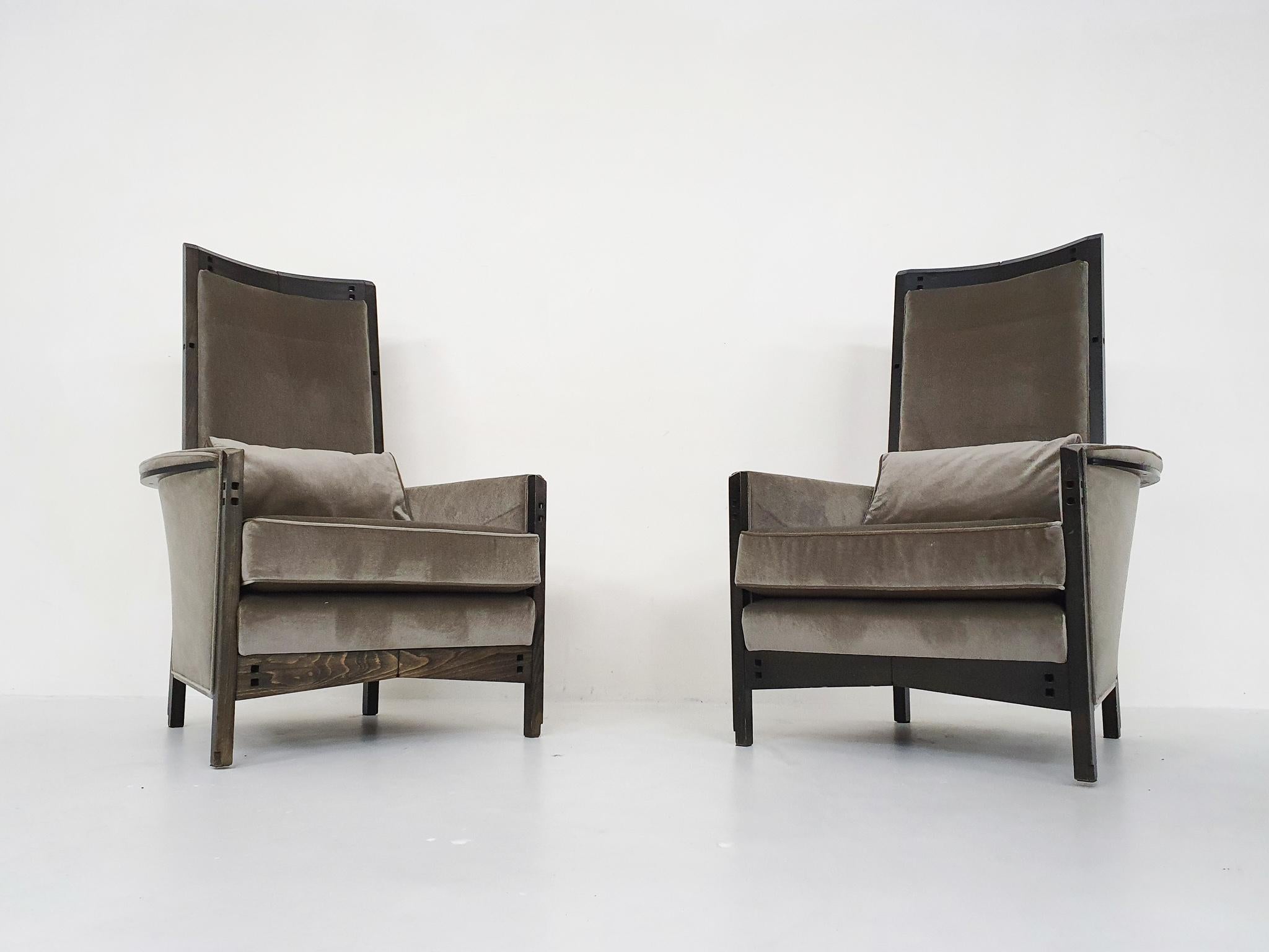 A pair of impressive lounge chairs with a “throne like” appearance, designed by Umberto Asnago for Giorgetti in the 1990’s.
The chairs are made of a wooden frame and new taupe velvet upholstery.