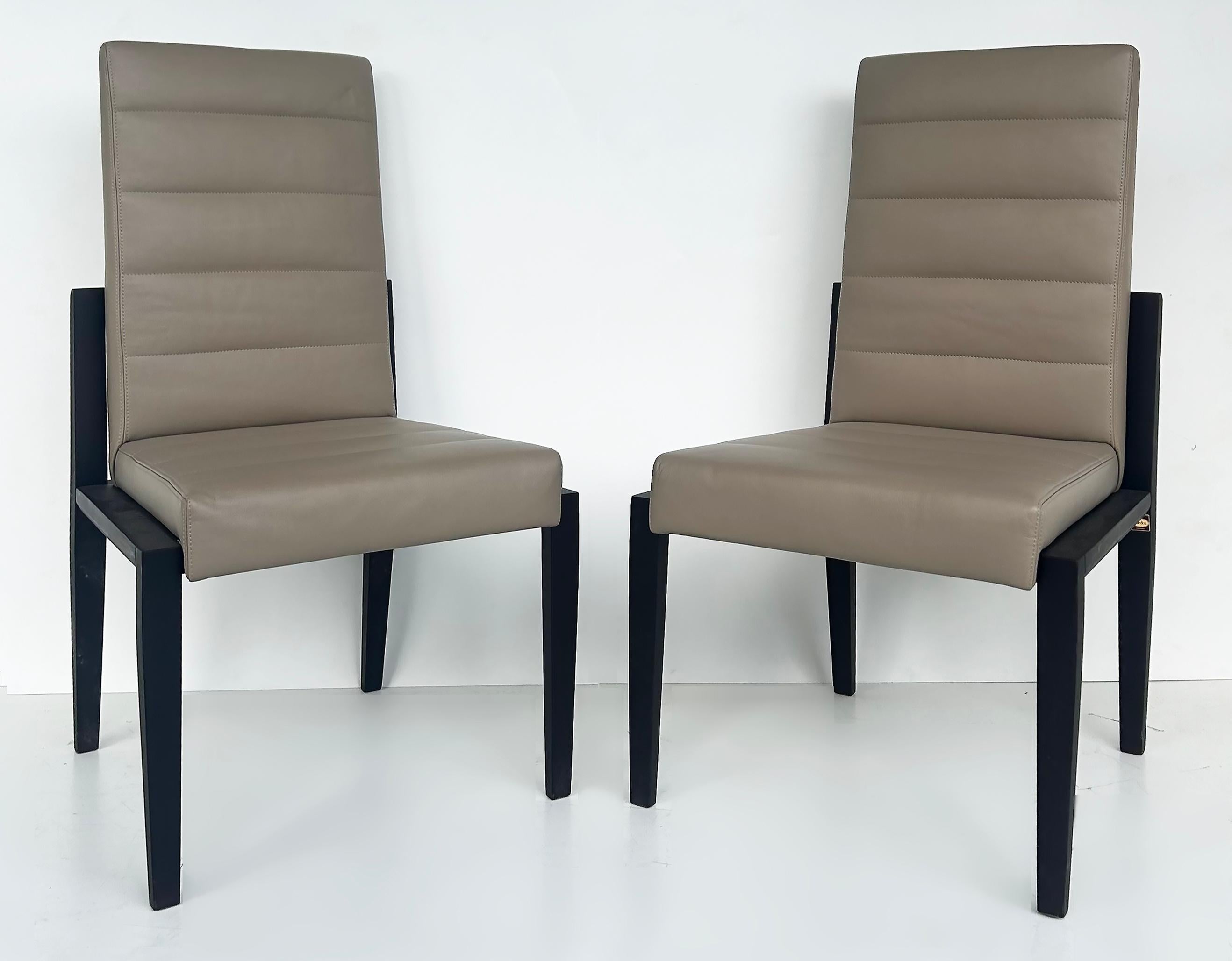 Umberto Asnago for Mobilidea Italian Leather/Oak Tall Chairs, Pair  

Offered for sale is a wonderful pair of Italian leather and stained mocha or espresso wood oak tall dining chairs manufactured by the Italian fine furniture maker Mobilidea. They