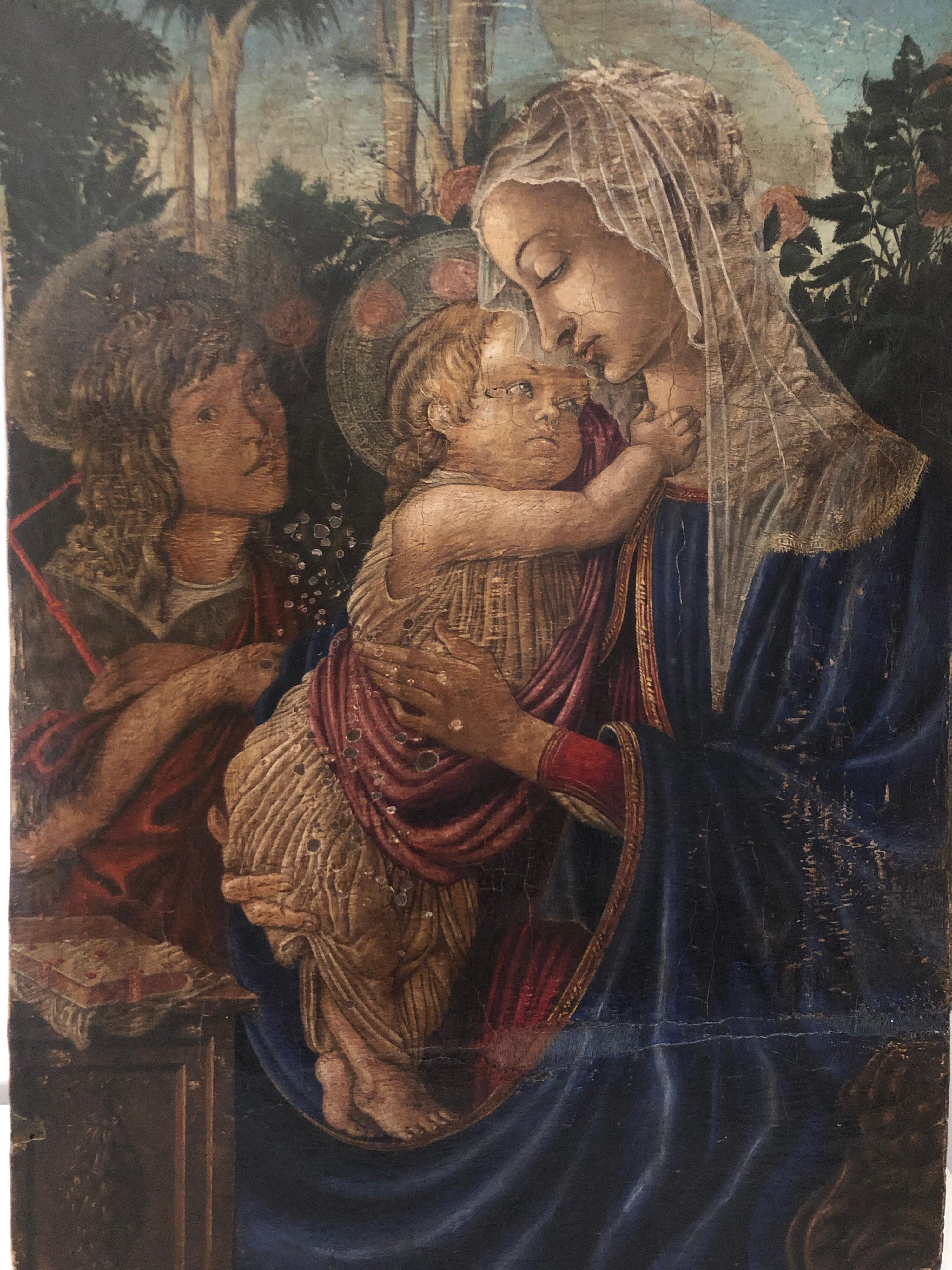 Oil on board depicting the Madonna with child and Saint John the Baptist in the early 20th century by the painter Umberto Giunti (1886-1970).
It is complemented by an architectonic framework which offer a view into a rose garden. The rose garden is
