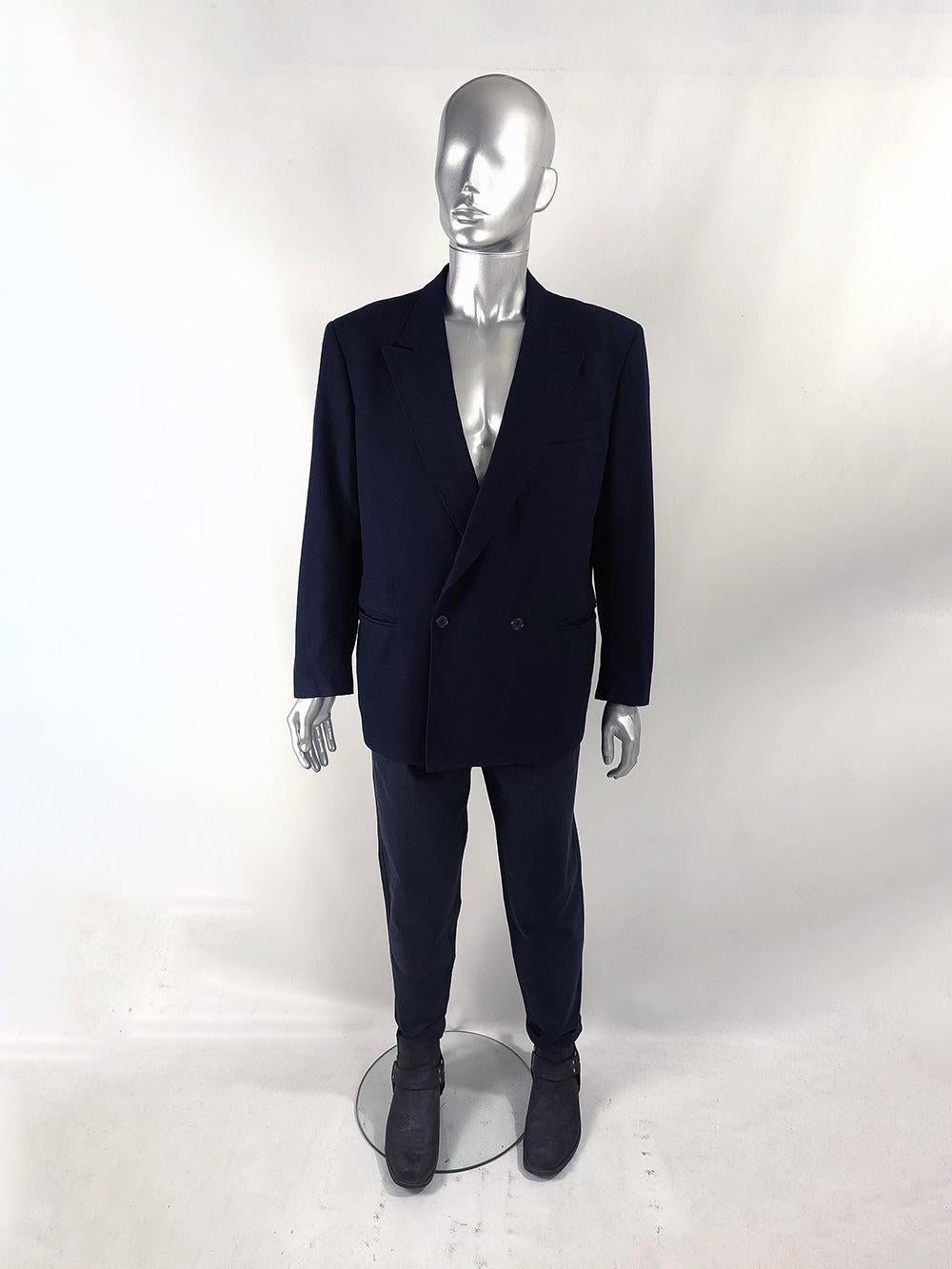 An excellent vintage mens blazer from the 80s by Italian tailor, Umberto Lambuccini of Milan. Made in Italy, from a navy blue pure new wool fabric. This jacket has a 1940s inspiration with its bold shoulders, single set of double breasted buttons