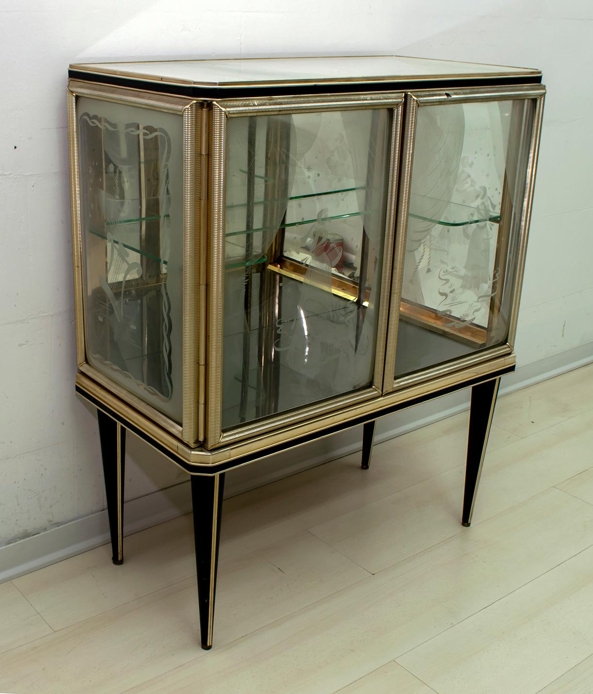 Bar cabinet designed by Umberto Mascagni of Bologna in the 1950s. The main structure is made of solid European wood, covered in cream-colored vinyl with anodized aluminum, decorated sanded convex glasses. Even the legs are covered with black vinyl!