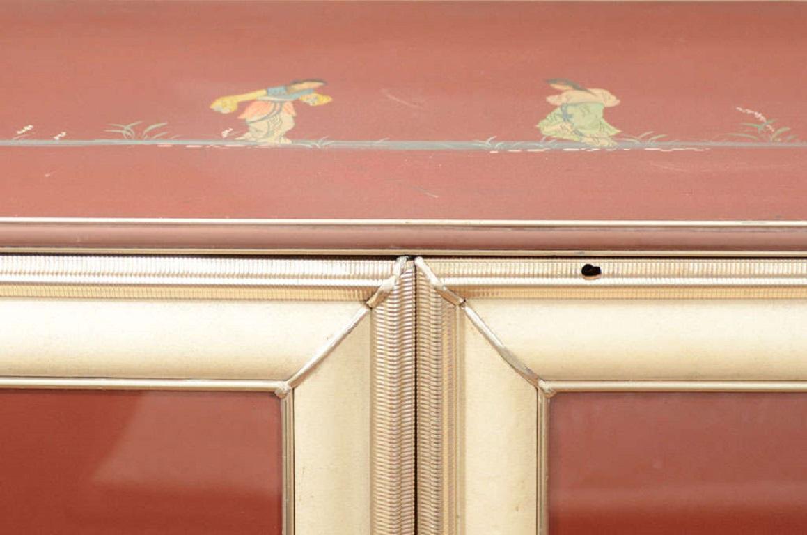 This narrow sideboard or bar cabinet is an interesting example of Italian midcentury design. Unusual mix of traditional chinoiserie decoration with Italian midcentury lines. Umberto Mascagni used materials that were provocative for the time, such as