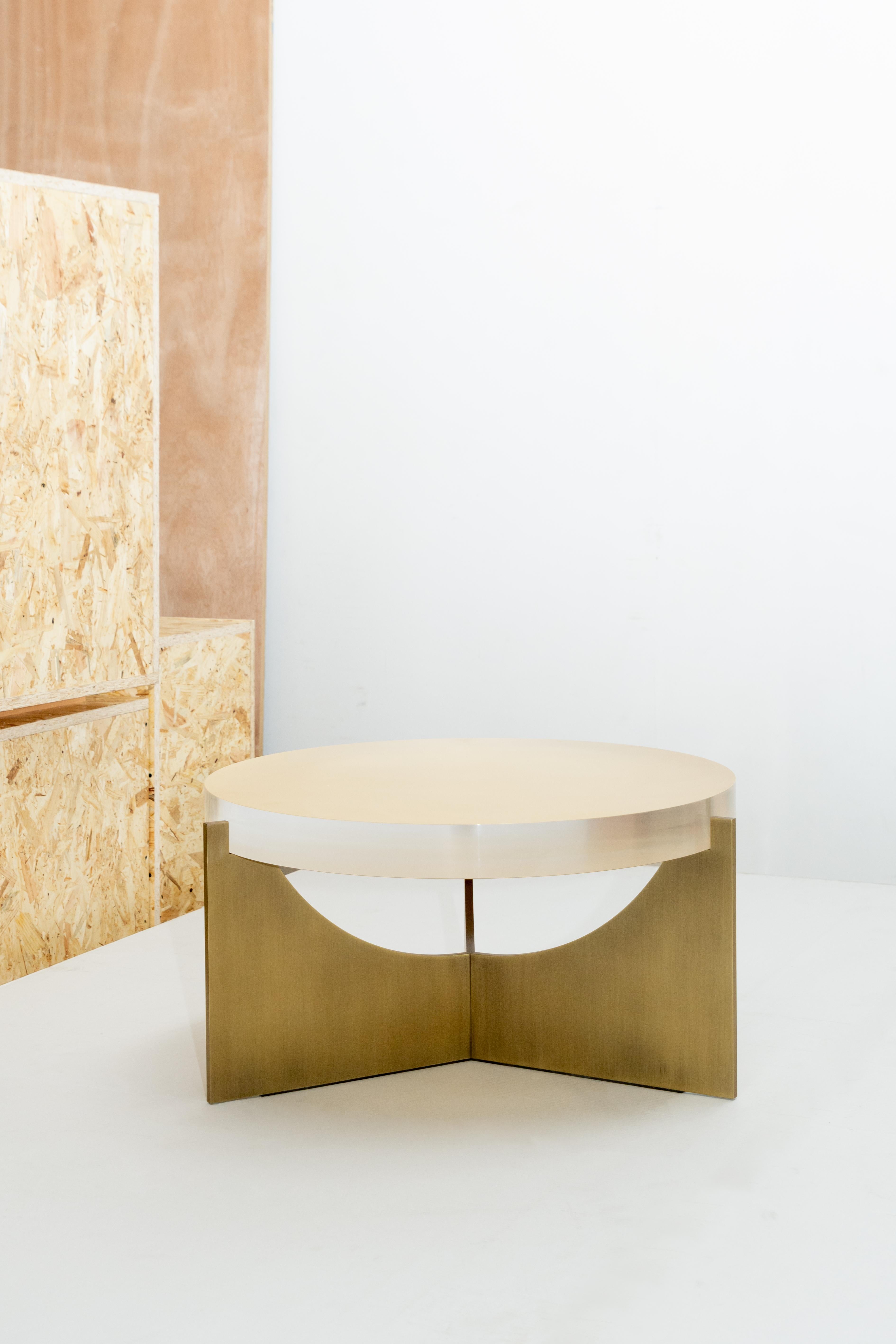 Umbra side table by Simon Hamui
Dimensions: D 70 x W 70 x H 37 cm
Materials: metal, Acrylic, gold leaf
Also available in different dimensions and materials. 

Side table made up of a metal base with a solid acrylic top underlined with a silver