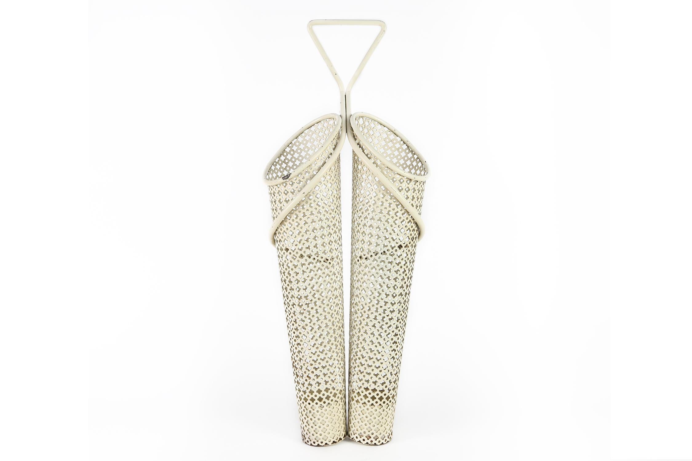 Umbrella holder by French designer Mategot in enameld en perforated steel, designed in the 1950s
In good condition with its original paint.