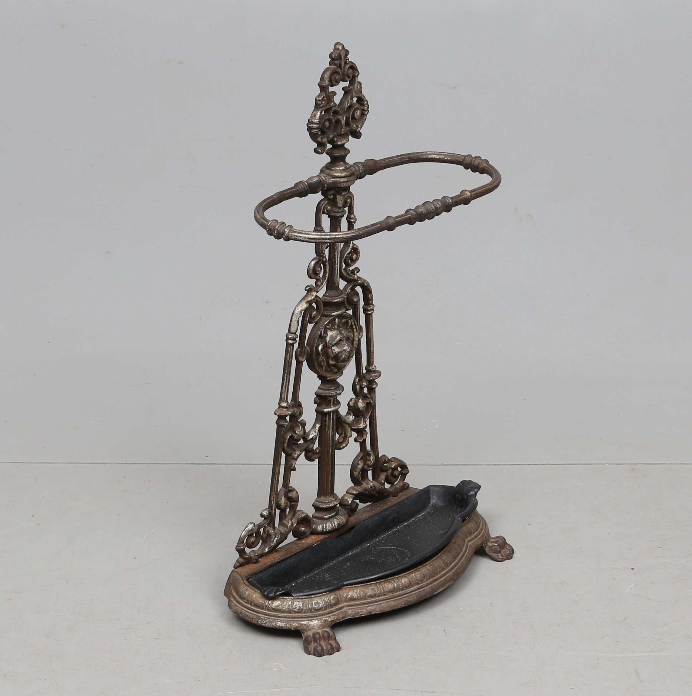 Cast iron foot with umbrella holder with a steel removable dripping pan. Made in Austria in the second half of the 19th century.
