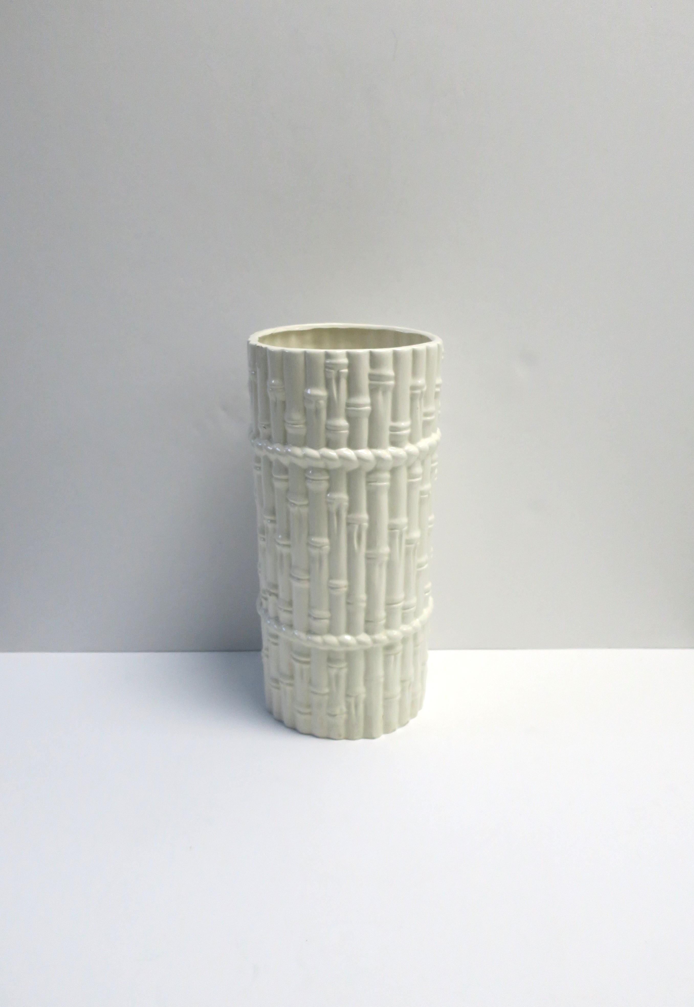 A white glazed ceramic umbrella holder stand with bamboo design, circa late-20th century, 1988. Piece can also double as a tall vase. Measurements: 8
