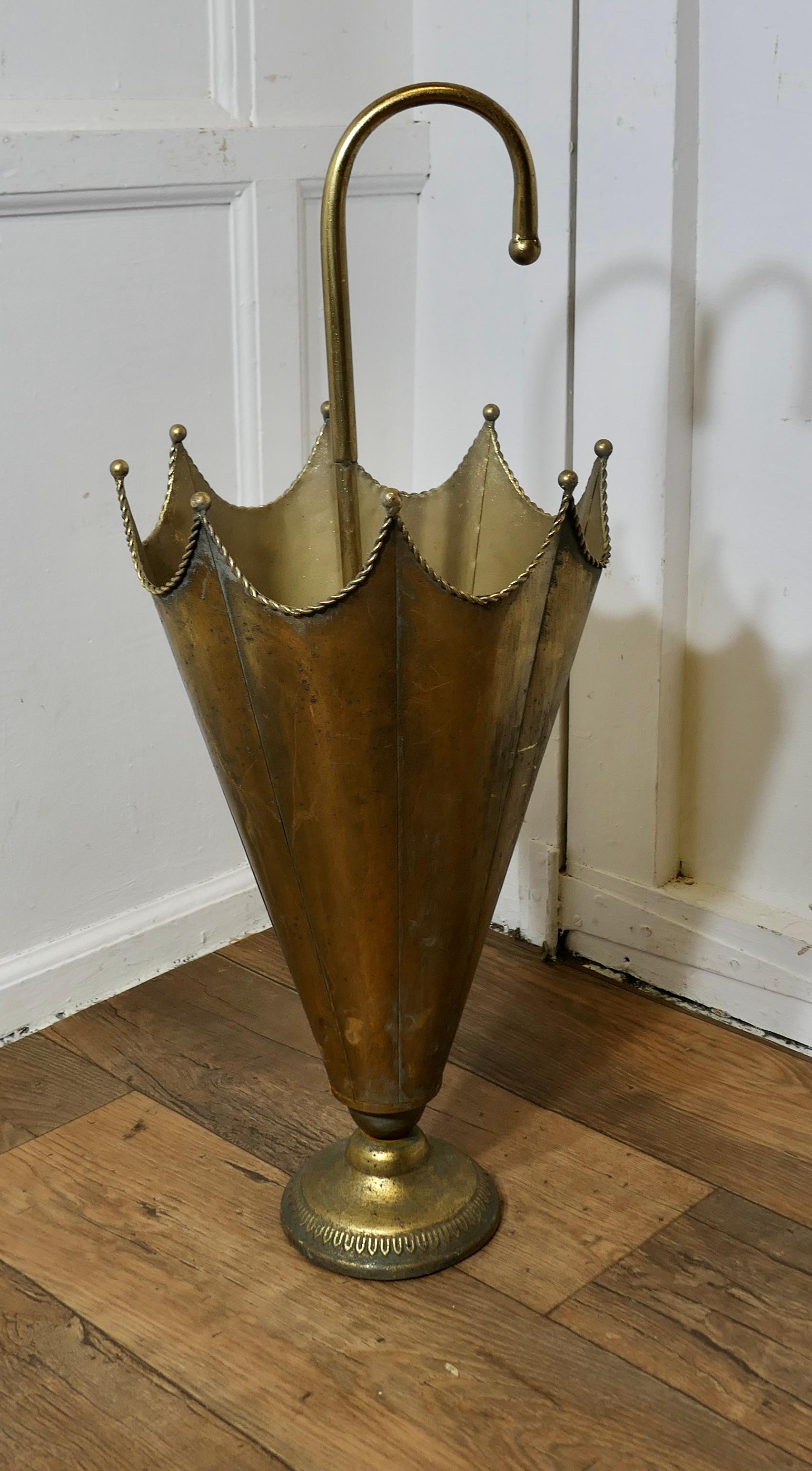 Umbrella Shaped Brass Umbrella Stand

An unusual and attractive piece, made in brass in the shape of an open umbrella
The stand has an elegant hooped handle  
The stand is 31” tall and 12” in diameter 
TFB197