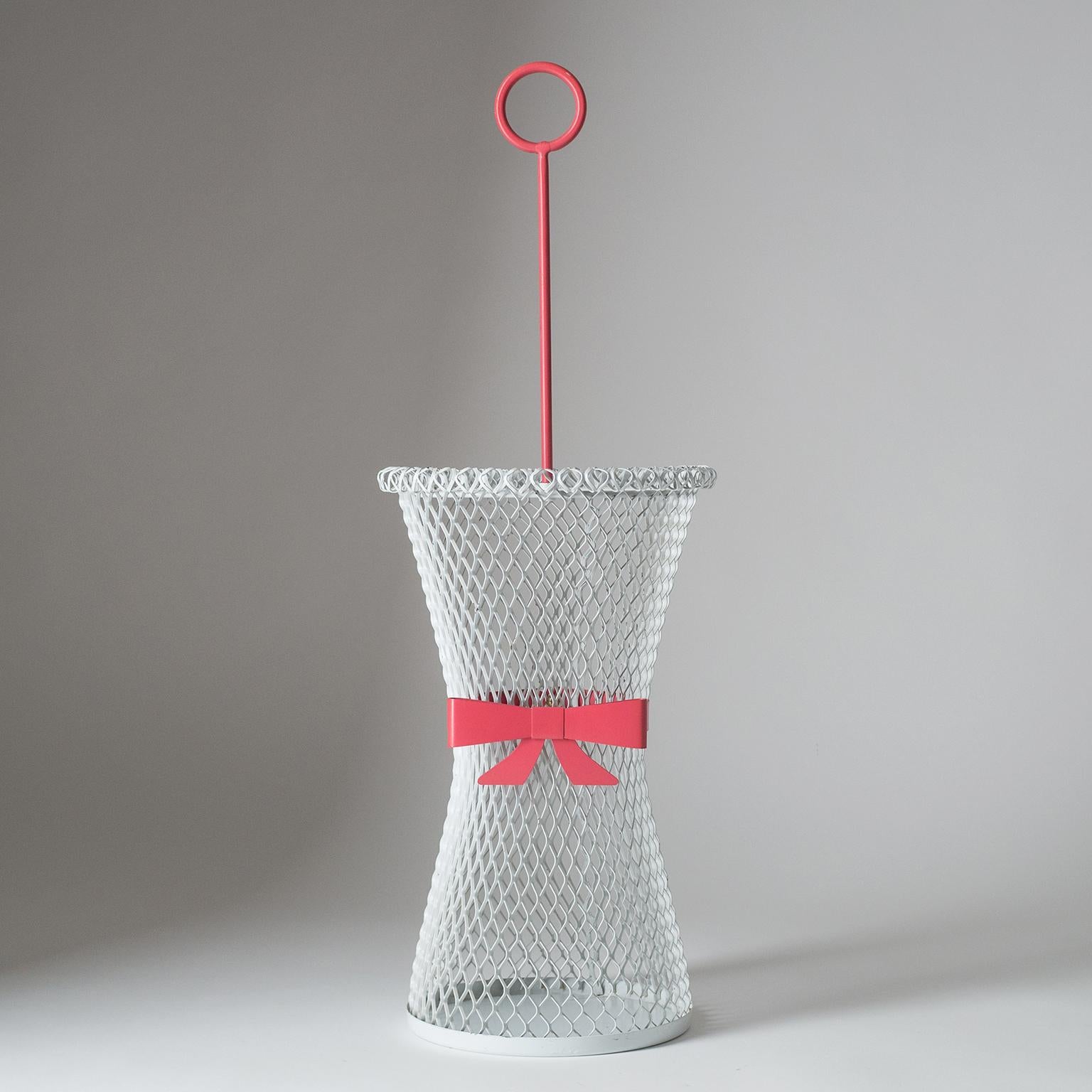 Charming Mategot-style umbrella stand from the 1950s. Expanded steel tapered body enameled in white with contrasting grip and ribbon around the 'waist'.