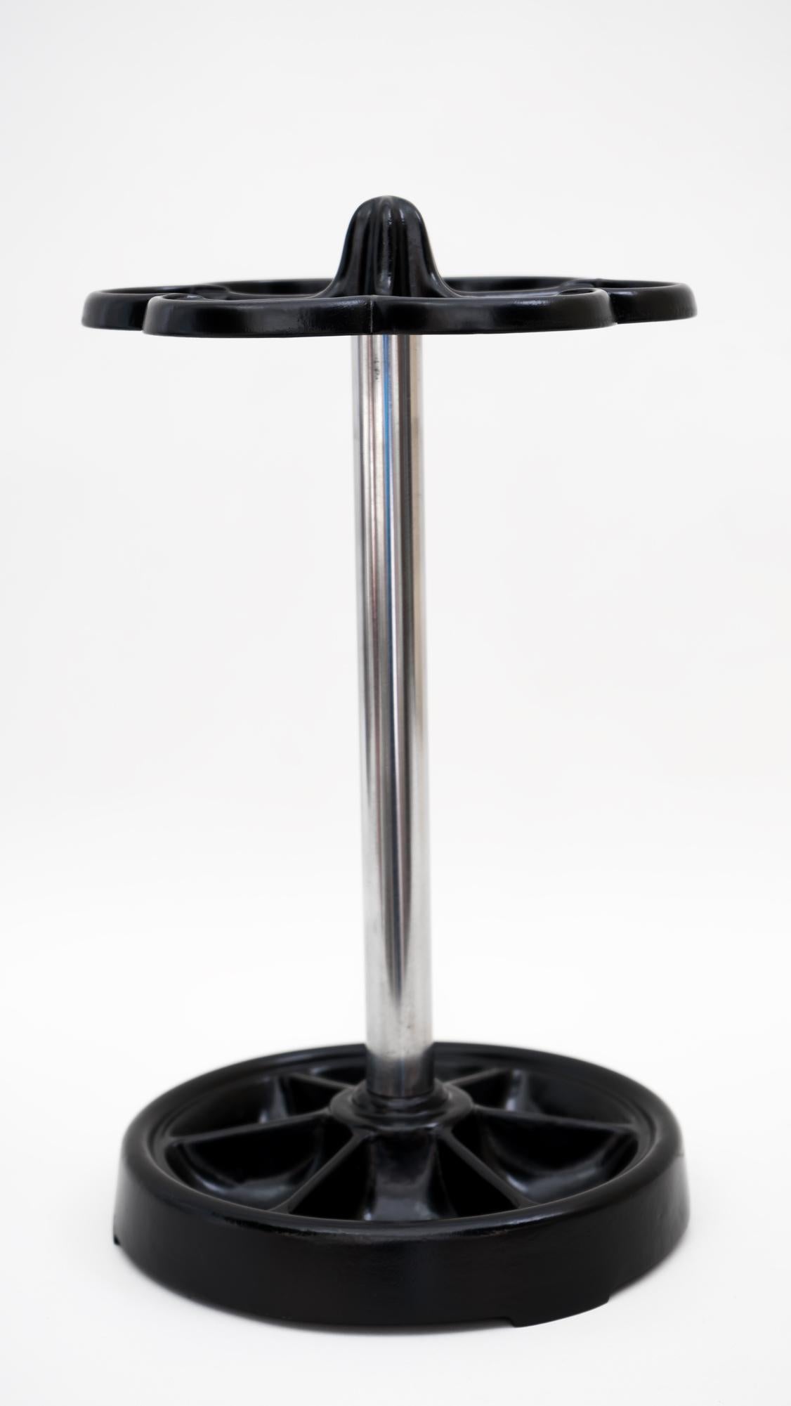 Umbrella stand, circa 1950s.
Iron and nickel combination
Iron is black lacquered.