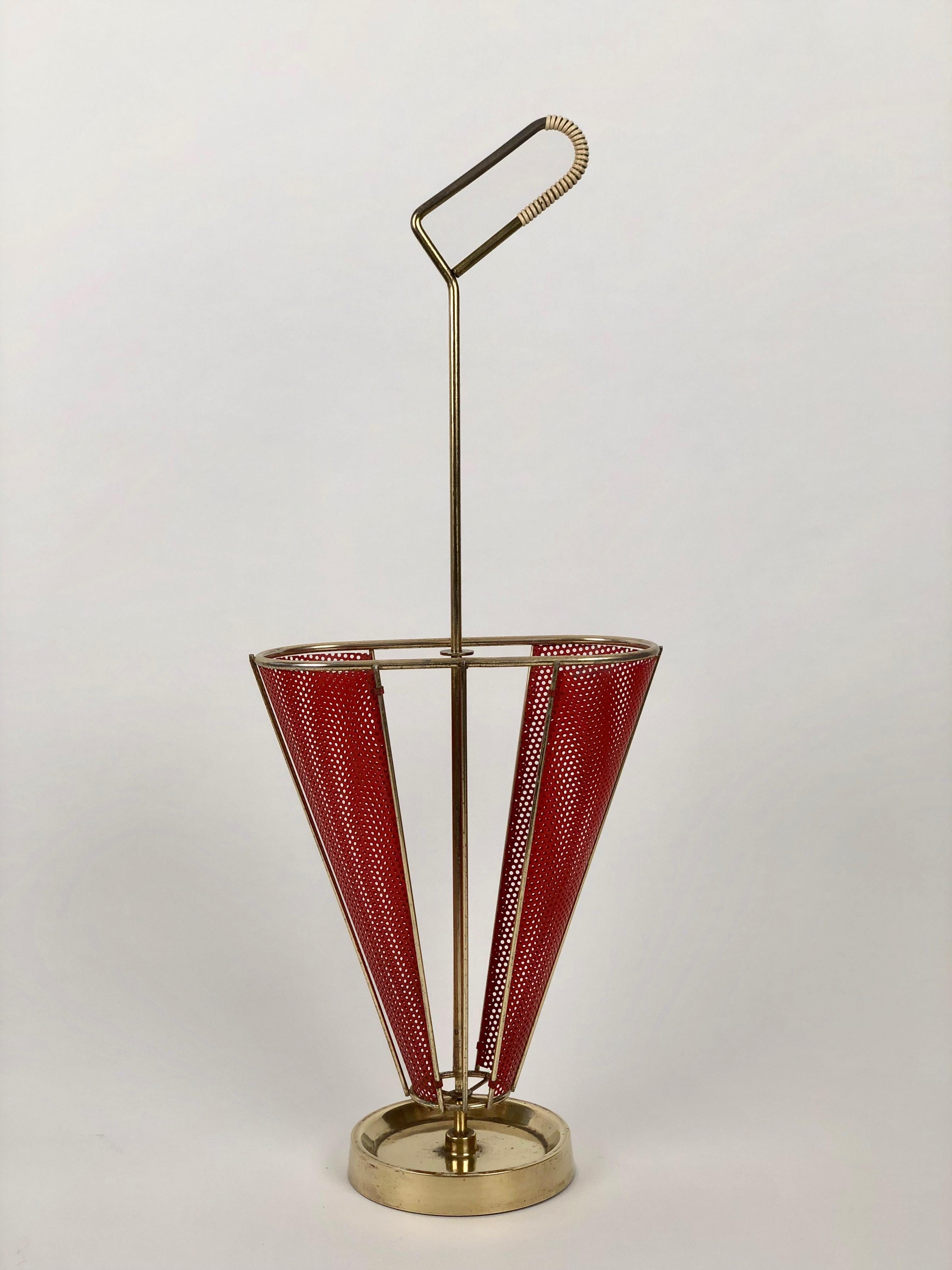 An umbrella stand designed and produced by Mathieu Mategot from the 1950's. 
The stand uses Mategot s own technique of combining metal tubes or rods with 
perforated metal sheet.

Like fabric, Rigtulle could be bent or folded and shaped to give