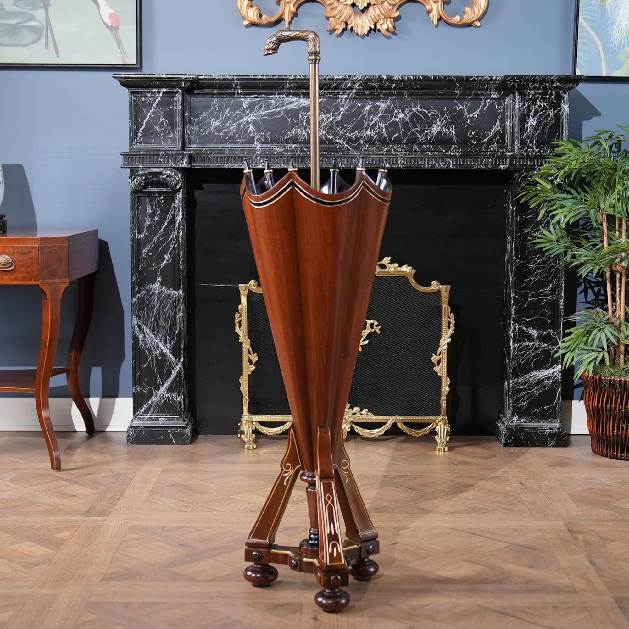 A wooden Umbrella Stand shaped like an umbrella. One of the rarest of antiques this is the Niagara Furniture version of a Mahogany and Brass Umbrella Stand. An umbrella shaped umbrella holder produced from the finest quality solid mahogany hardwoods